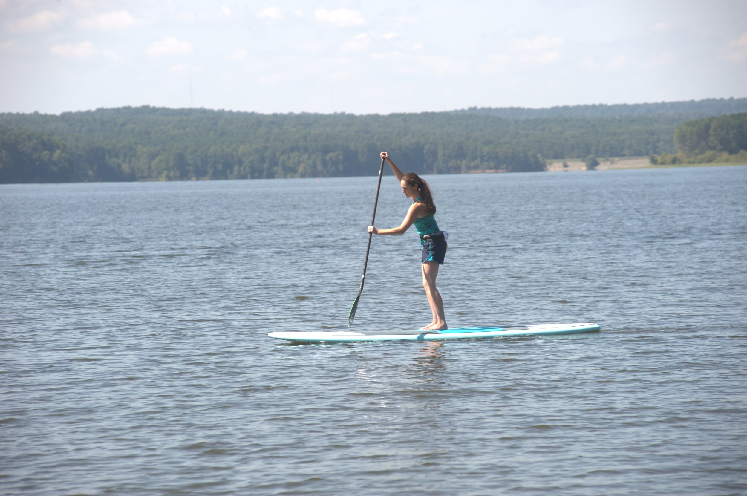 Always hold the paddle so the blade is angled away from you (toward the nose of the board).