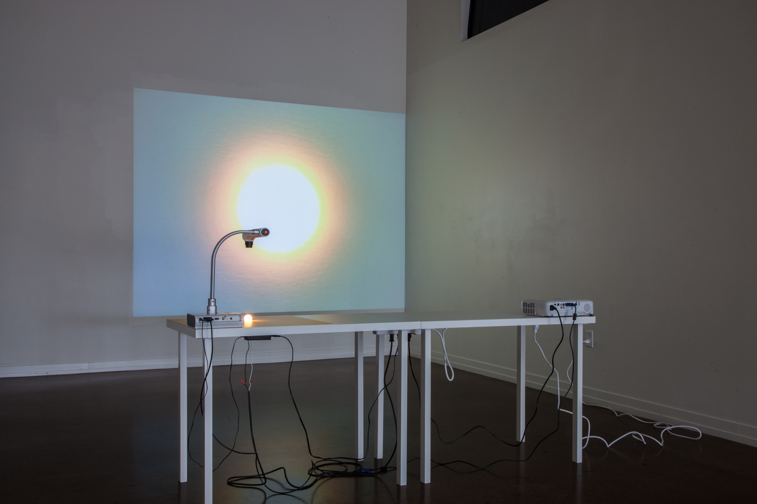 Patrick DeGuira- Building a Sun, 2015 - 16 Digitizer, video projector, 7W bulb, matboard, prefabricated table tops, painted steel; dimensions variable