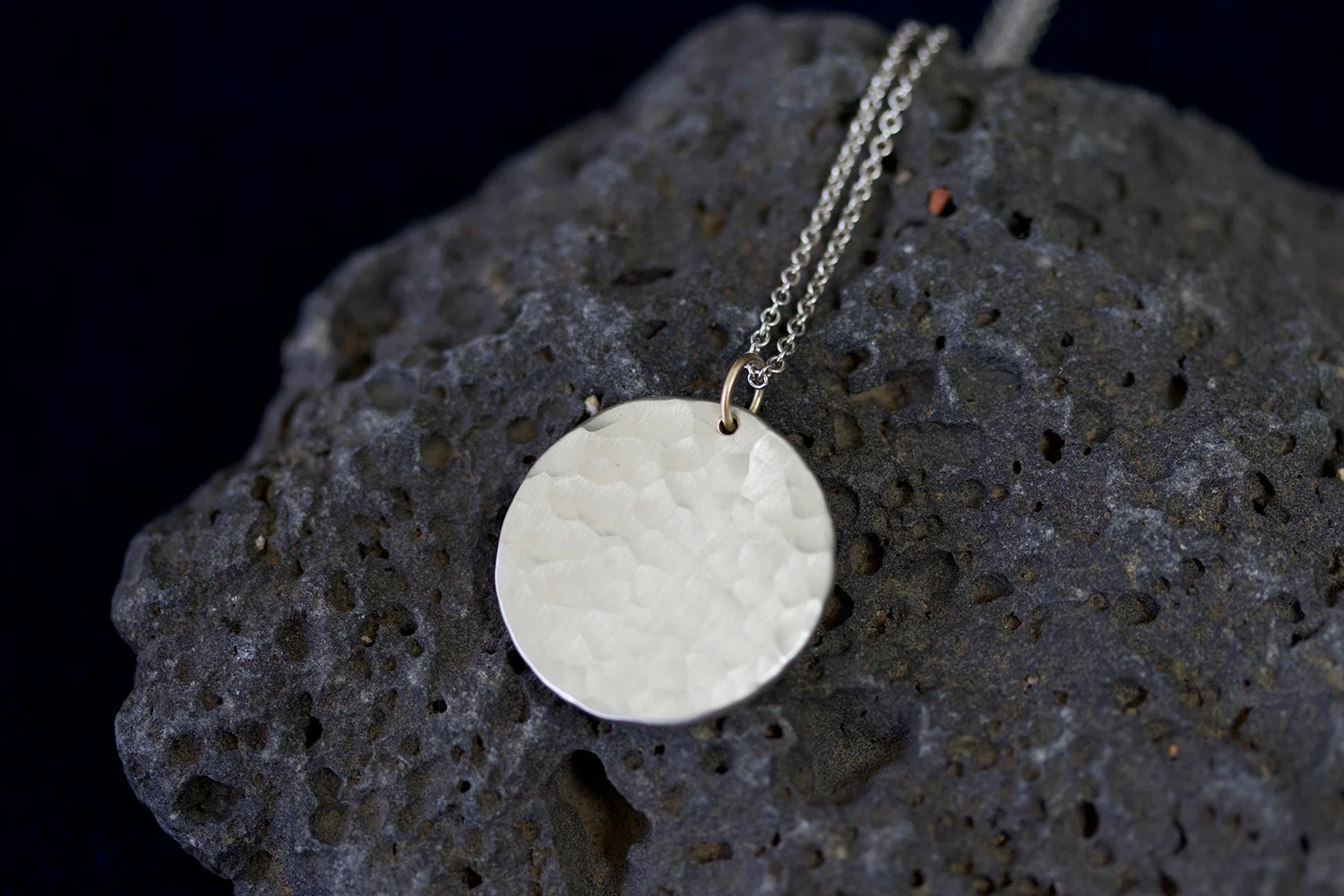 sol necklace on rock.jpg