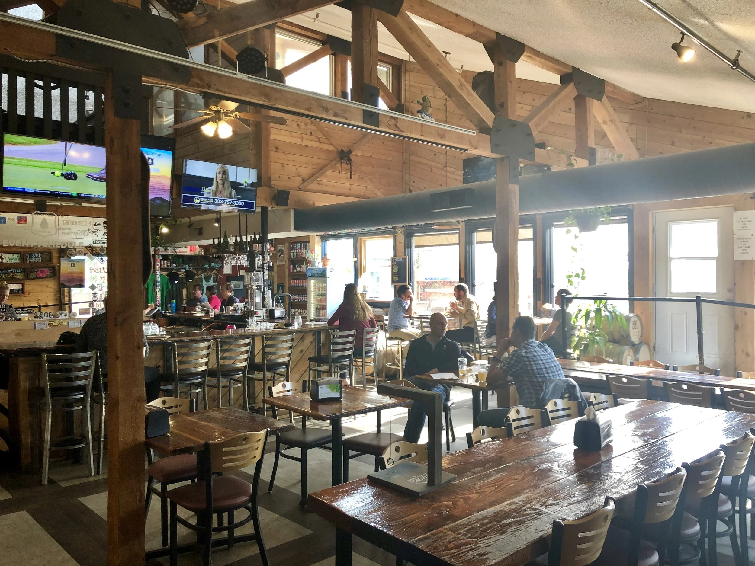 Evergreen Brewery’s inside bar area boasts tall ceilings, wood accents, and a great mountain vibe. ©Suzanne Brown 2019