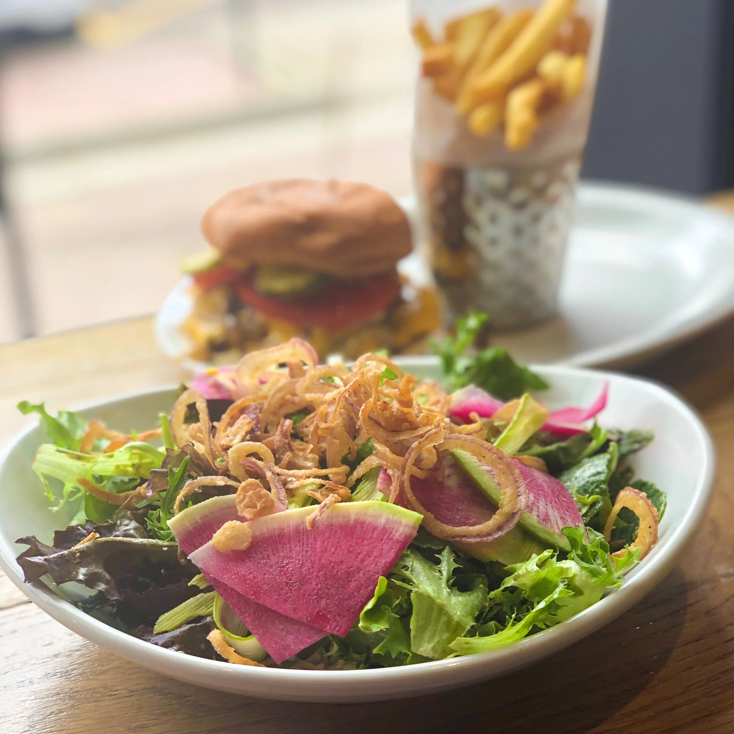 Spring Salad with watermelon radishes. Burger and fries always lurking. ©Suzanne Brown 2019