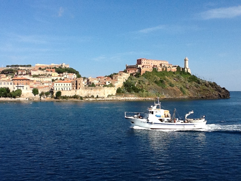 Entering Portoferrario in Elba. Napoleon's main residence is the yellow villa in the center.