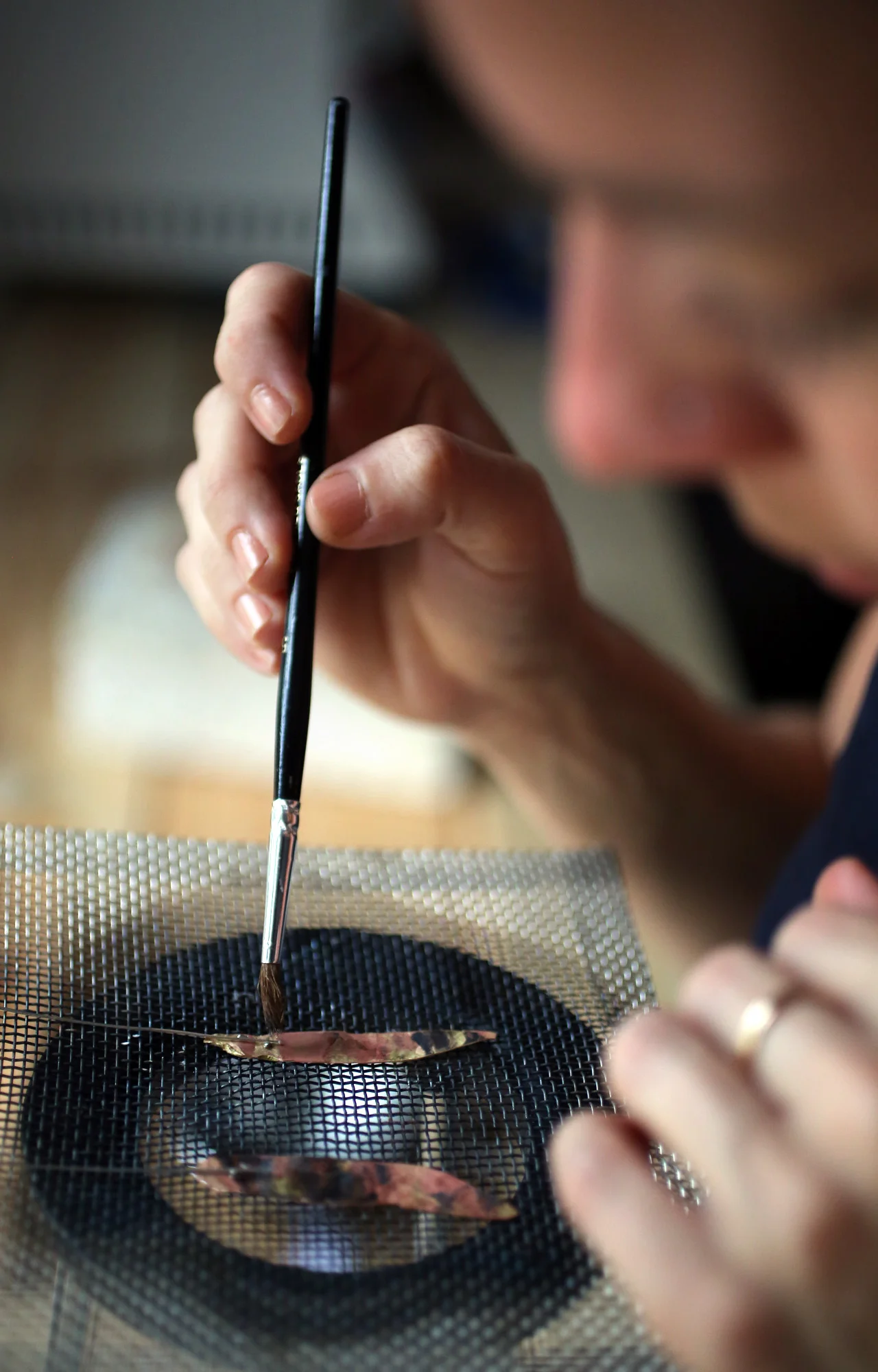 Preparing to solder silver wire onto the brass- which will become the ear wires.