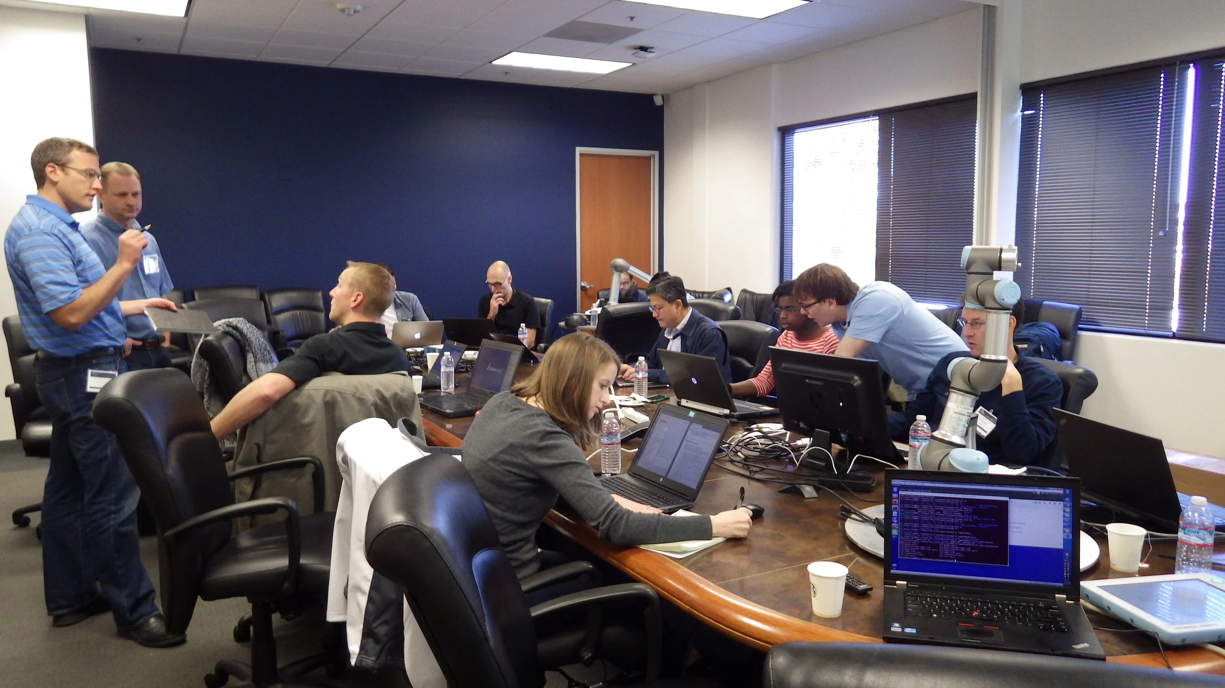 Lab day, an open space for side conversations, programming and robot interaction.
