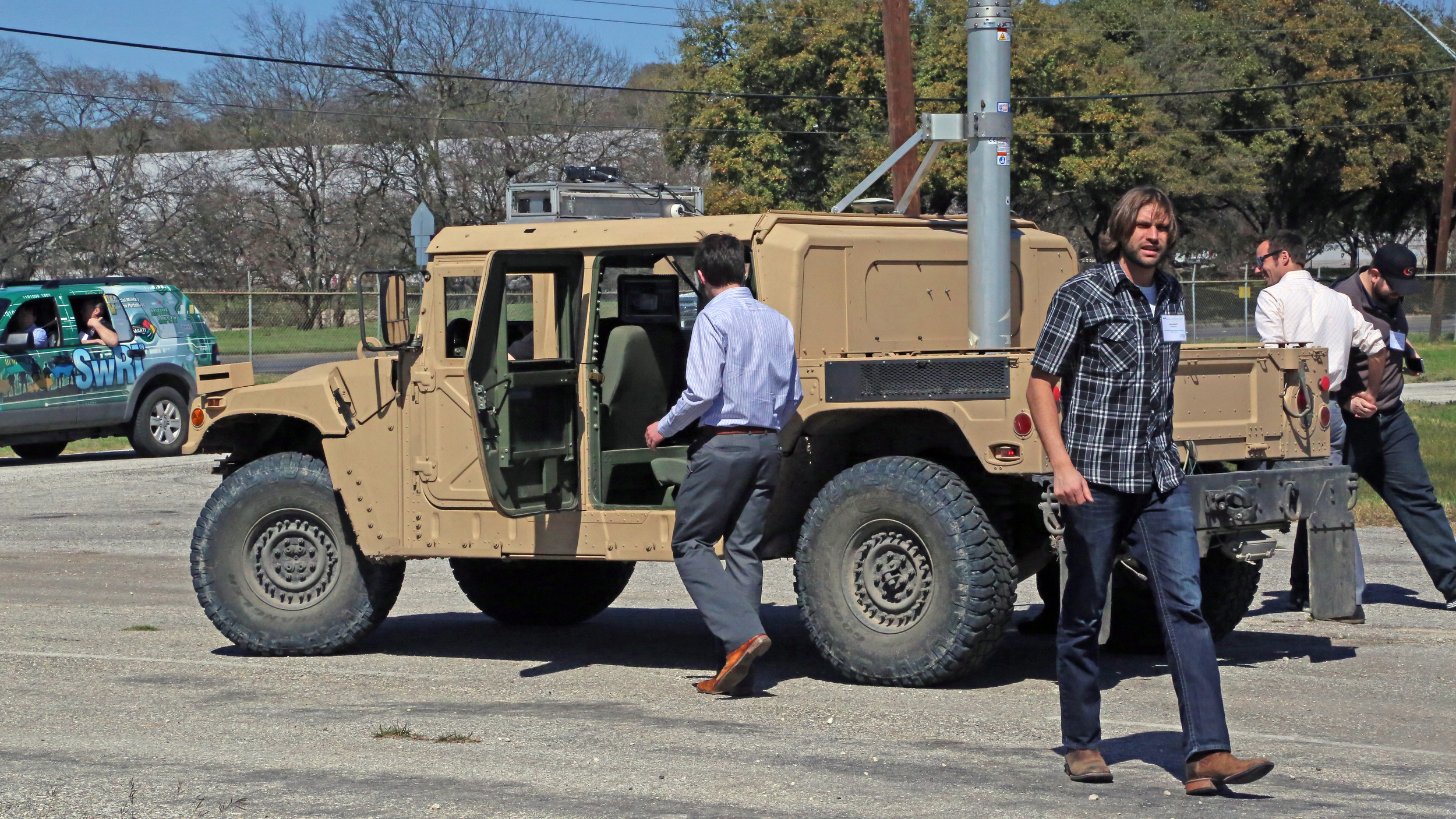 One vehicle navigated a slalom course while the other drove over a mix of paved and off-road Terrain.