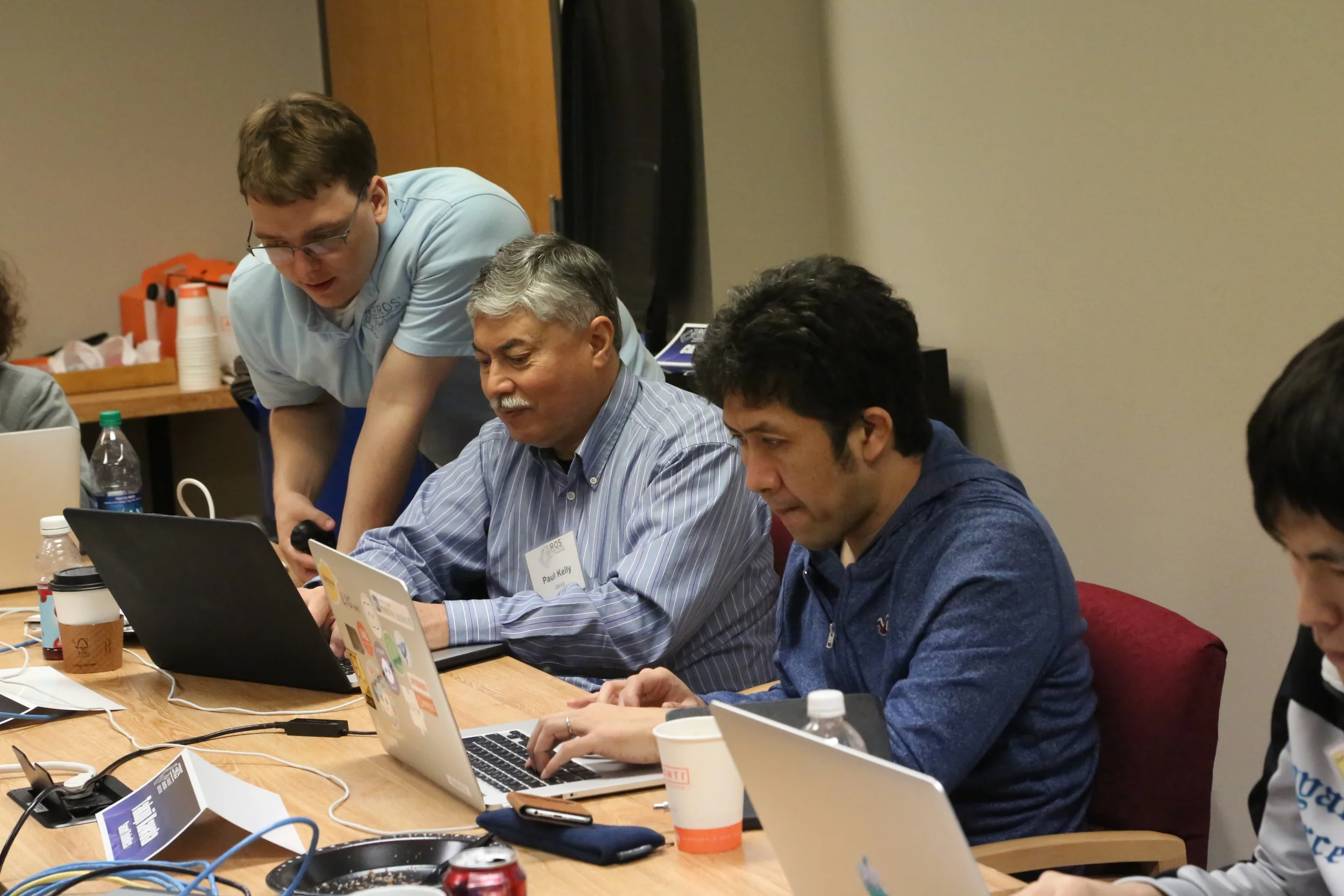 students independently walking through an online exercise while jonathan clarifies a point