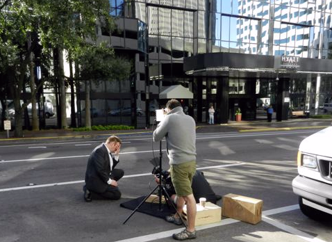 Shooting Henry on Jackson Street. We did 11 takes of Henry's scene in front of the towering skyscrapers. We wanted the shot free and clear of pedestrians. This became a challenge because of the duration of the scene, almost a full minute with no cuts. 