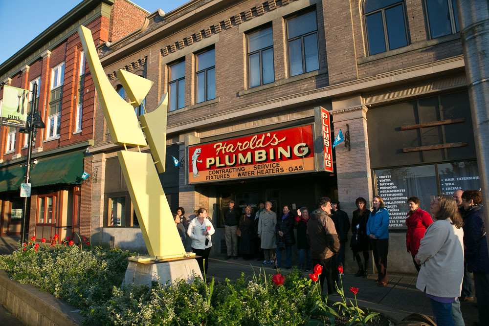 Francisco Salgado, NW Sculptor, large painted steel sculpture in yellow entitled 'Jump' in Auburn, WA