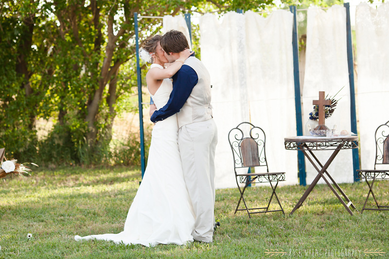 31.+bride_groom_kiss_aisle-1.jpg