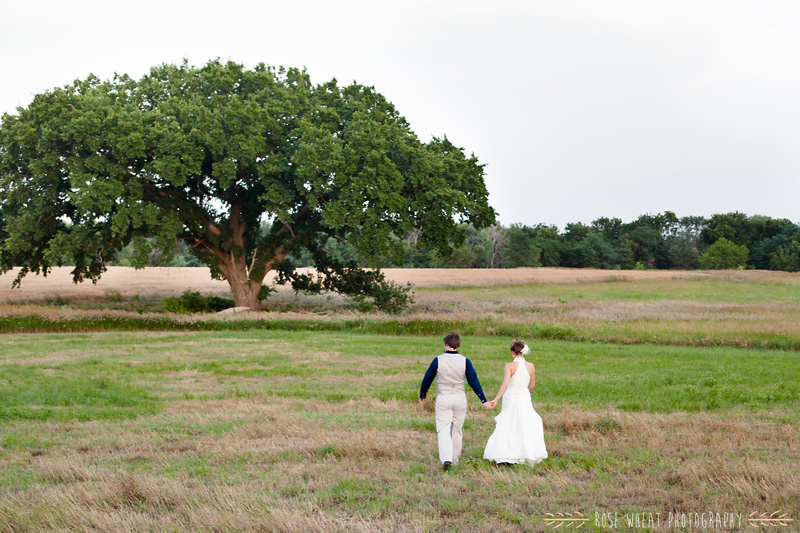 33.+bride_groom_walking_tree_field_country_wedding.jpg
