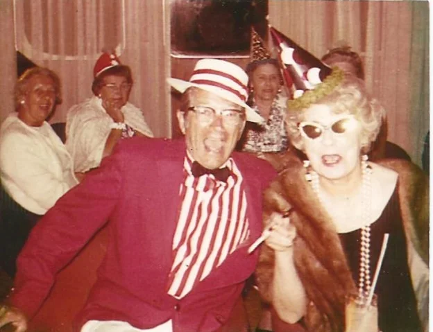 My grandfather, on a cruise with my grandmother wearing his signature red.