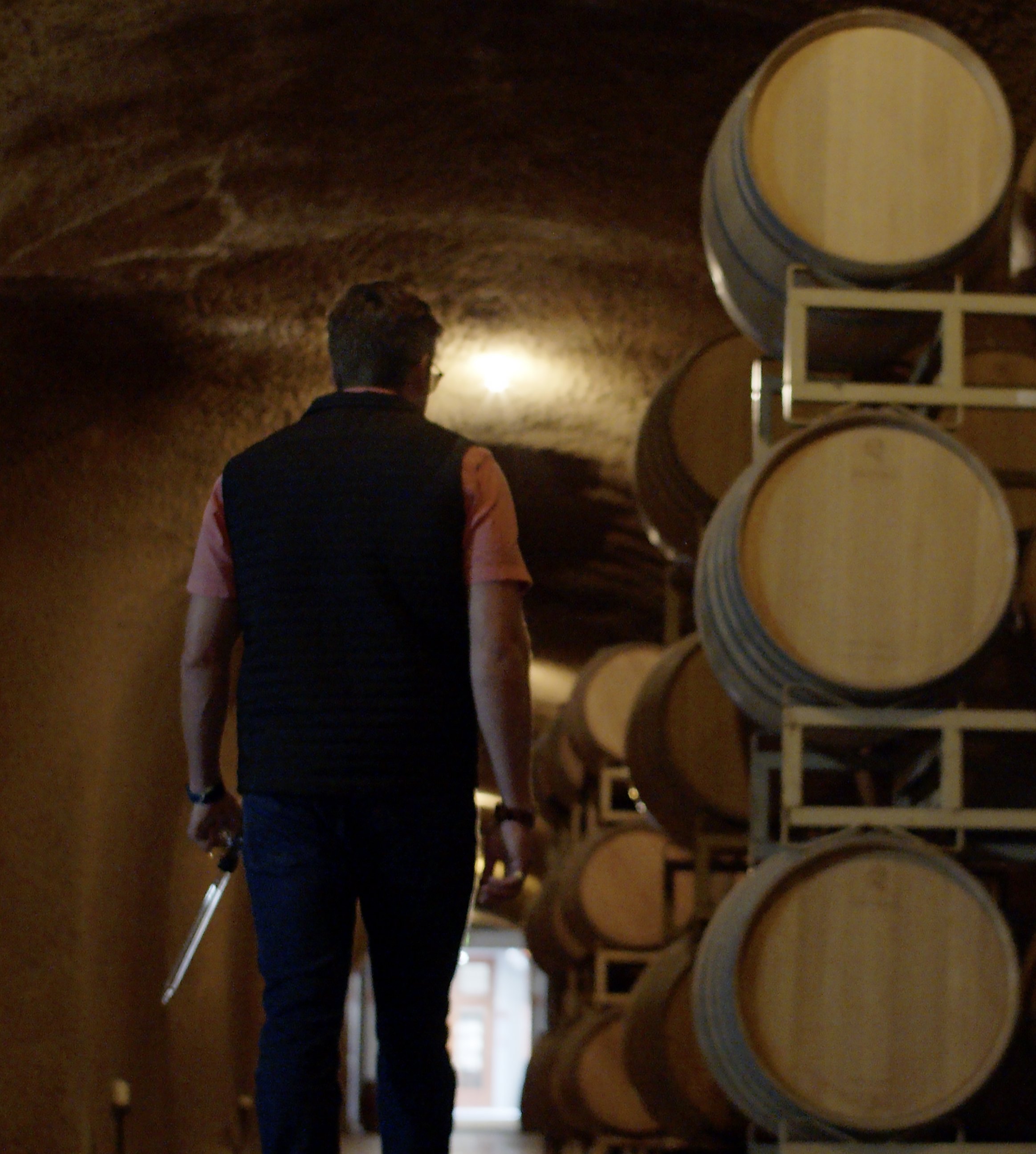 Sampling wine in the caves