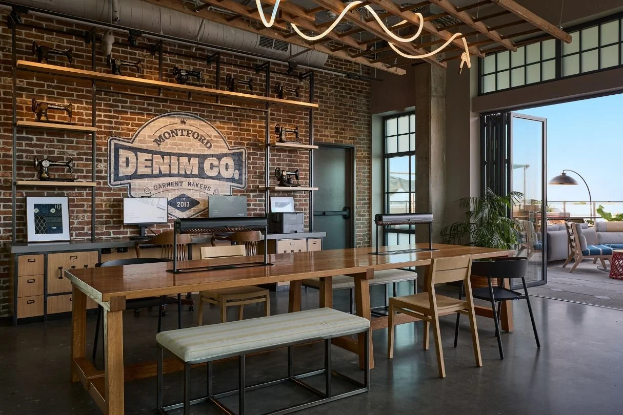 Business Center, custom stencil on brick and vintage sewing machine display.