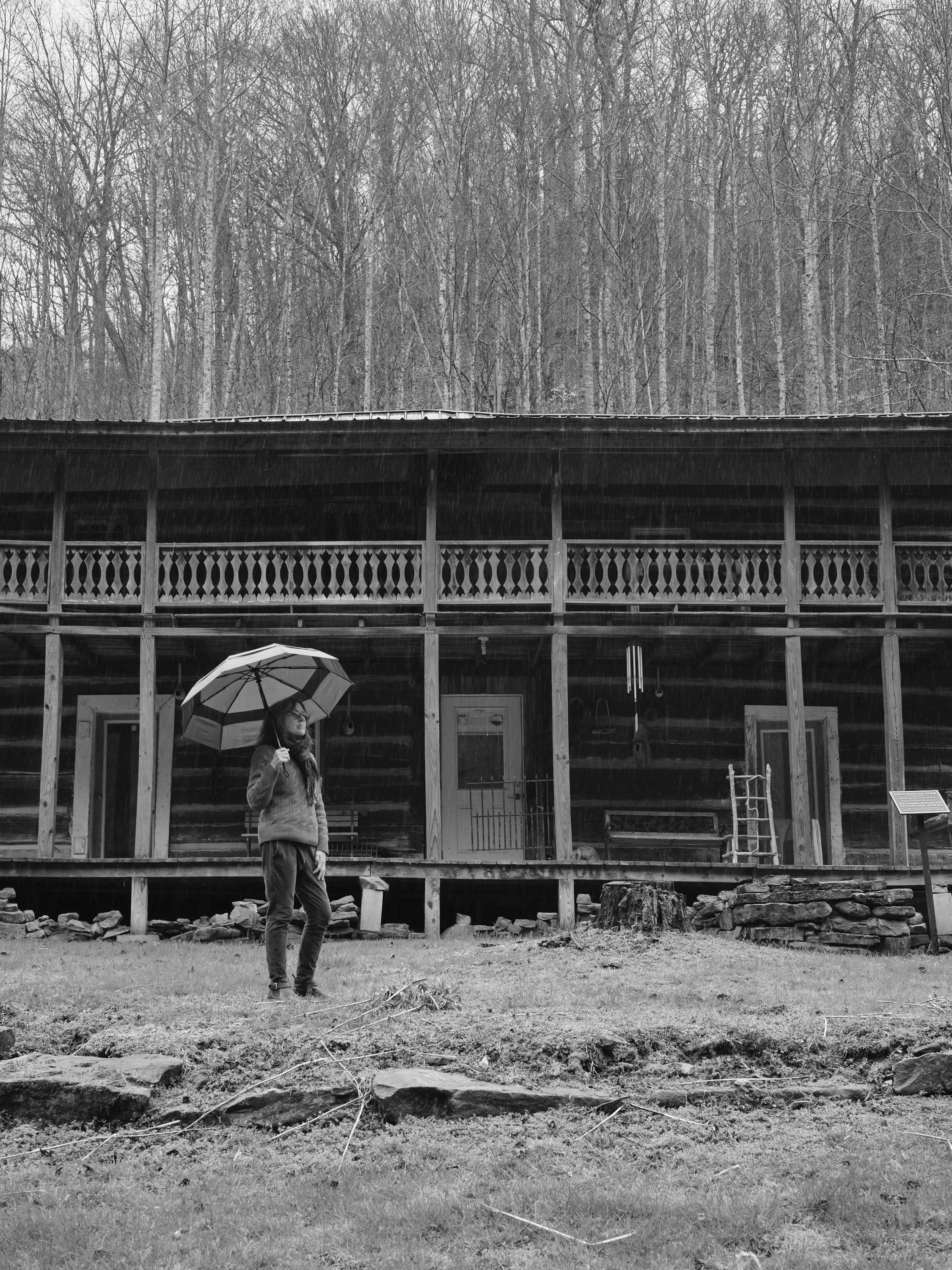 A woman holding an umbrella.