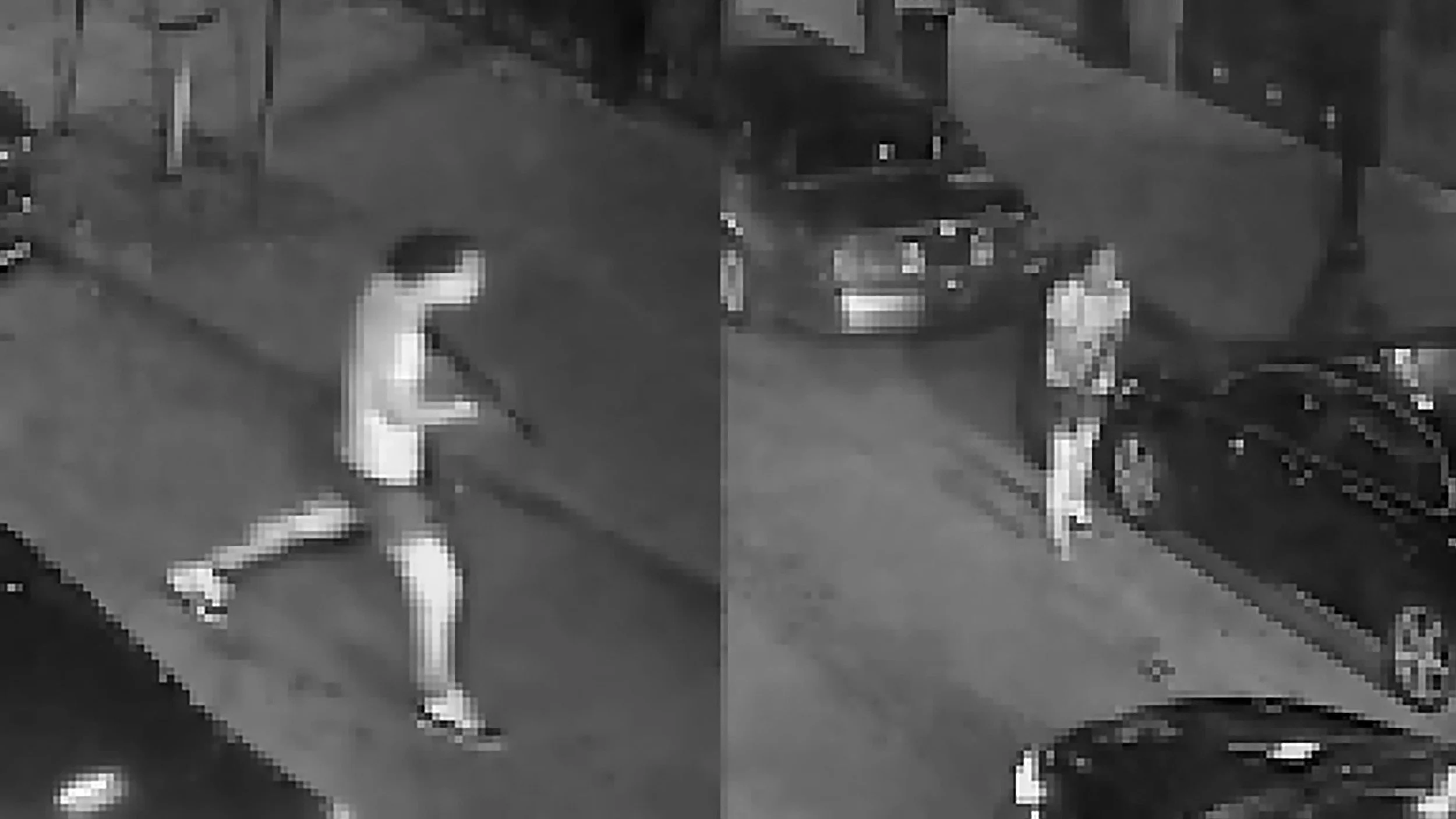 Black and white surveillance footage showing a person walking on a city street near parked cars, with two of the person nonchalantly walking.