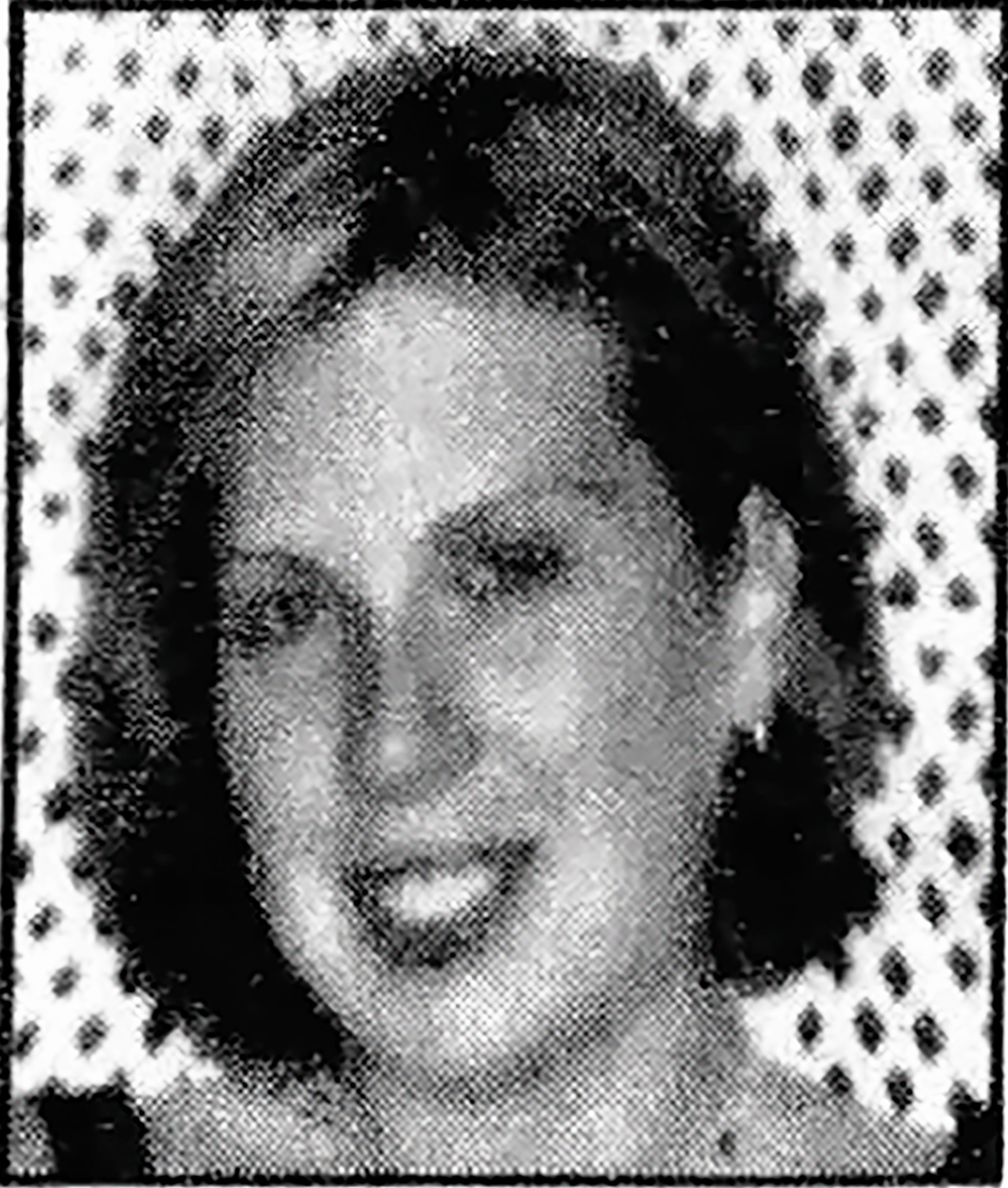 Black and white portrait of a woman with a patterned background.