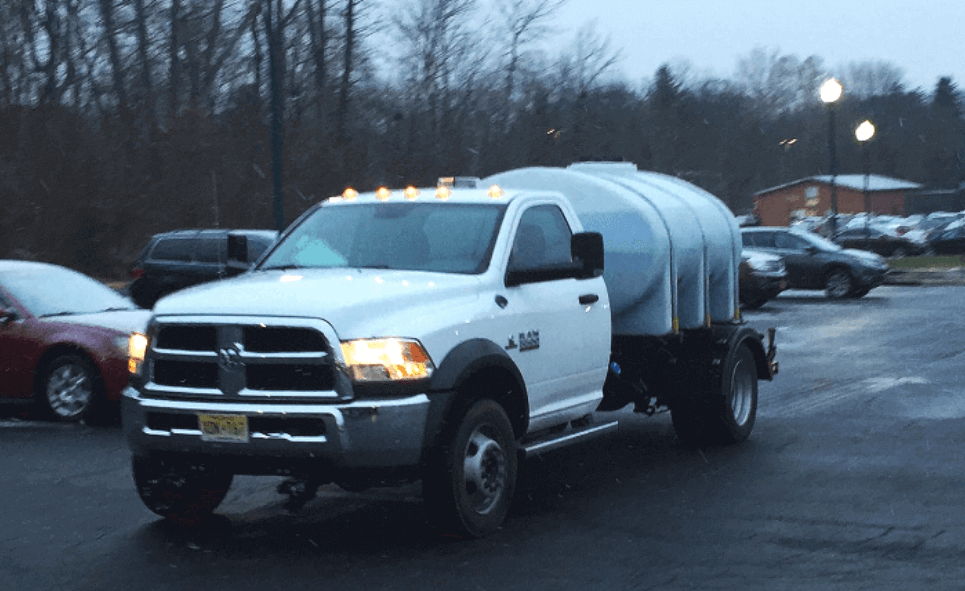 Xtreme Snow Pros Spraying De-Icer.png