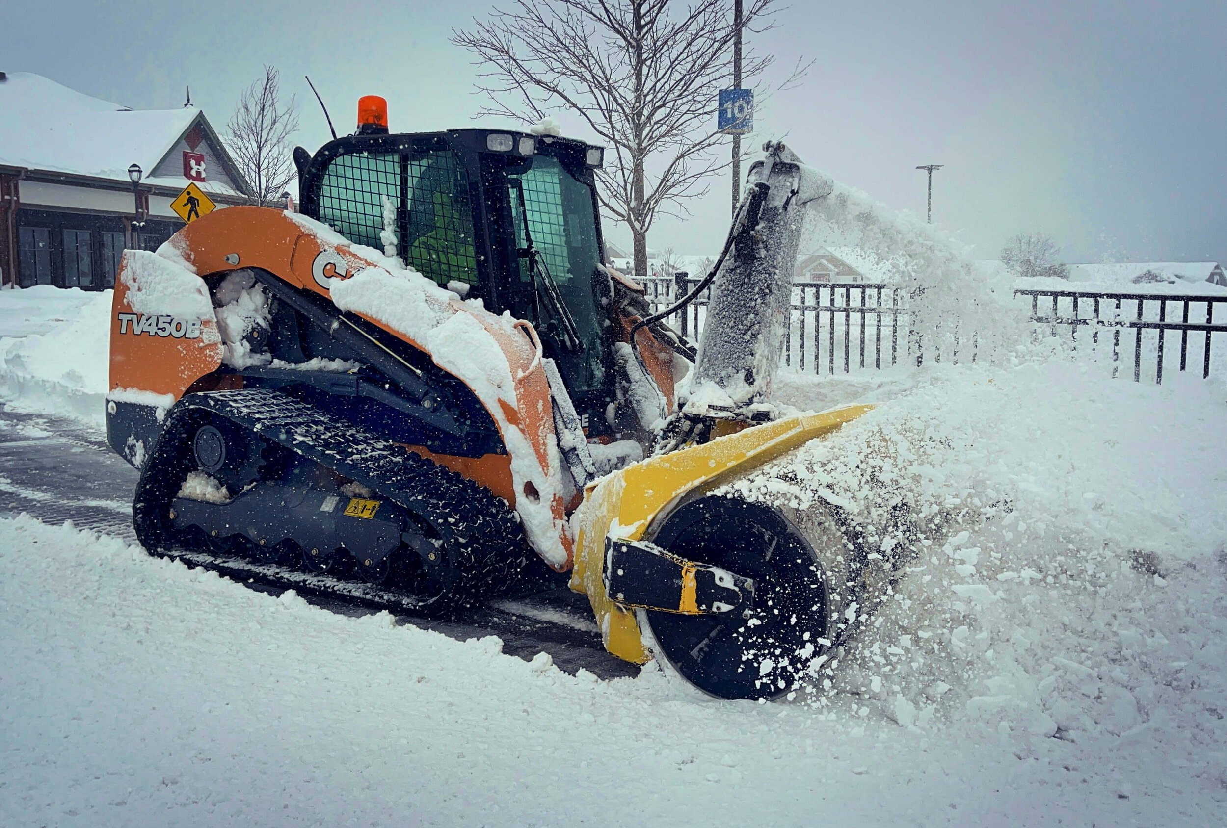 Case Skid Steer with Blower Attached Blowing Snow in New York State.jpg