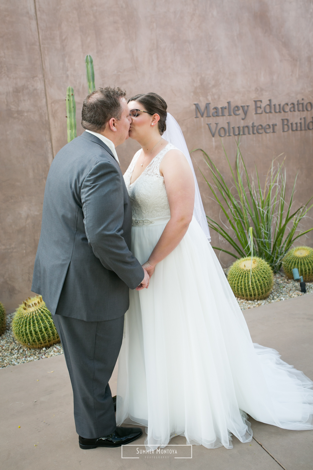 Bride and groom kissing at the Desert Botanical Gardens 