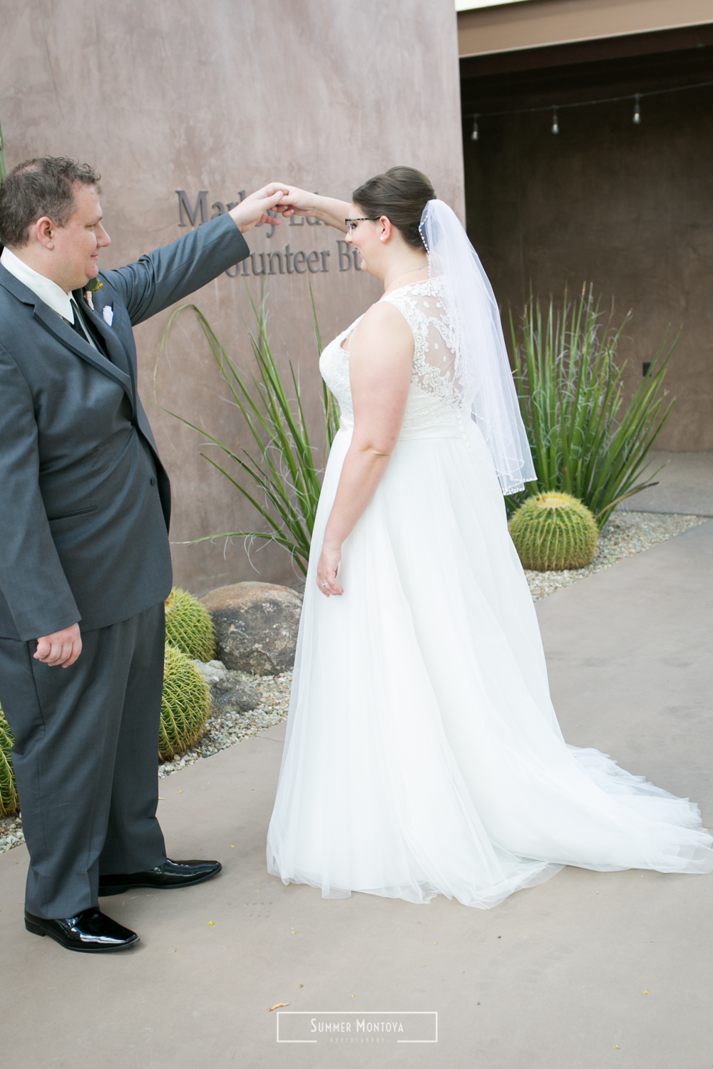  Groom twirling his bride at the Desert Botanical Gardens 