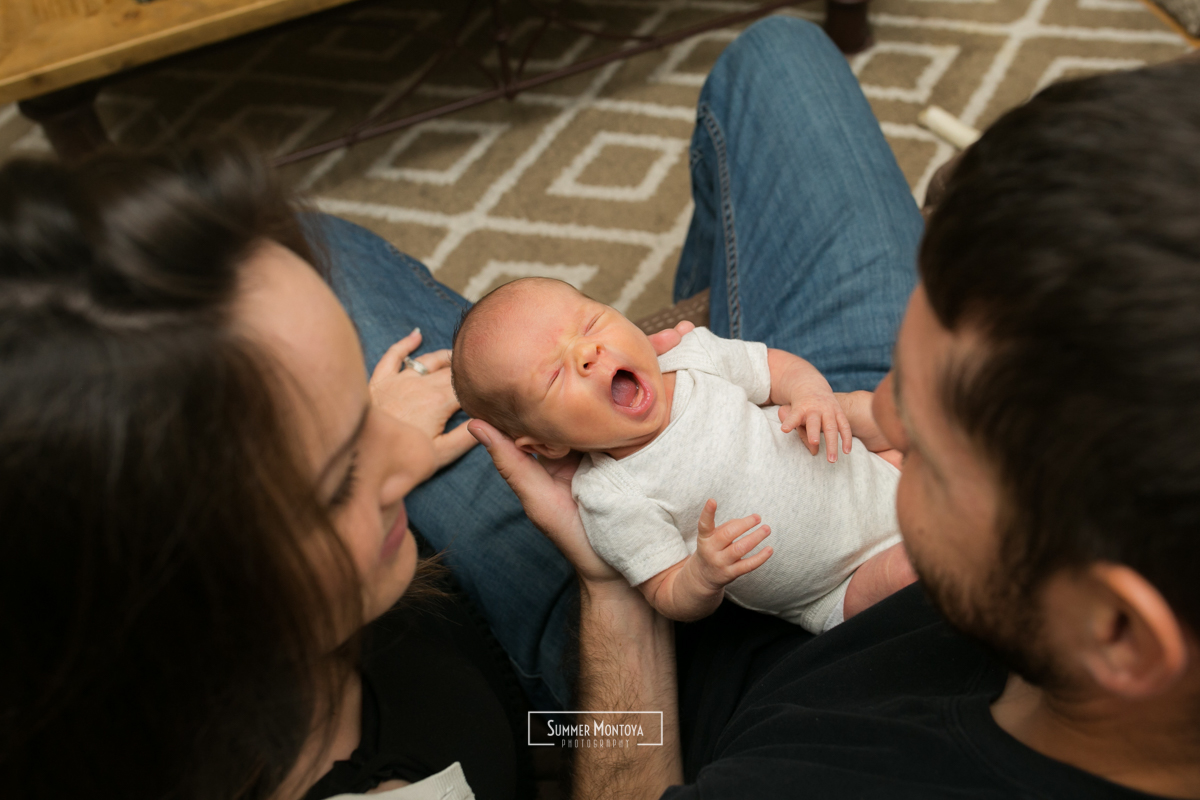 yawning-newborn-with-parents