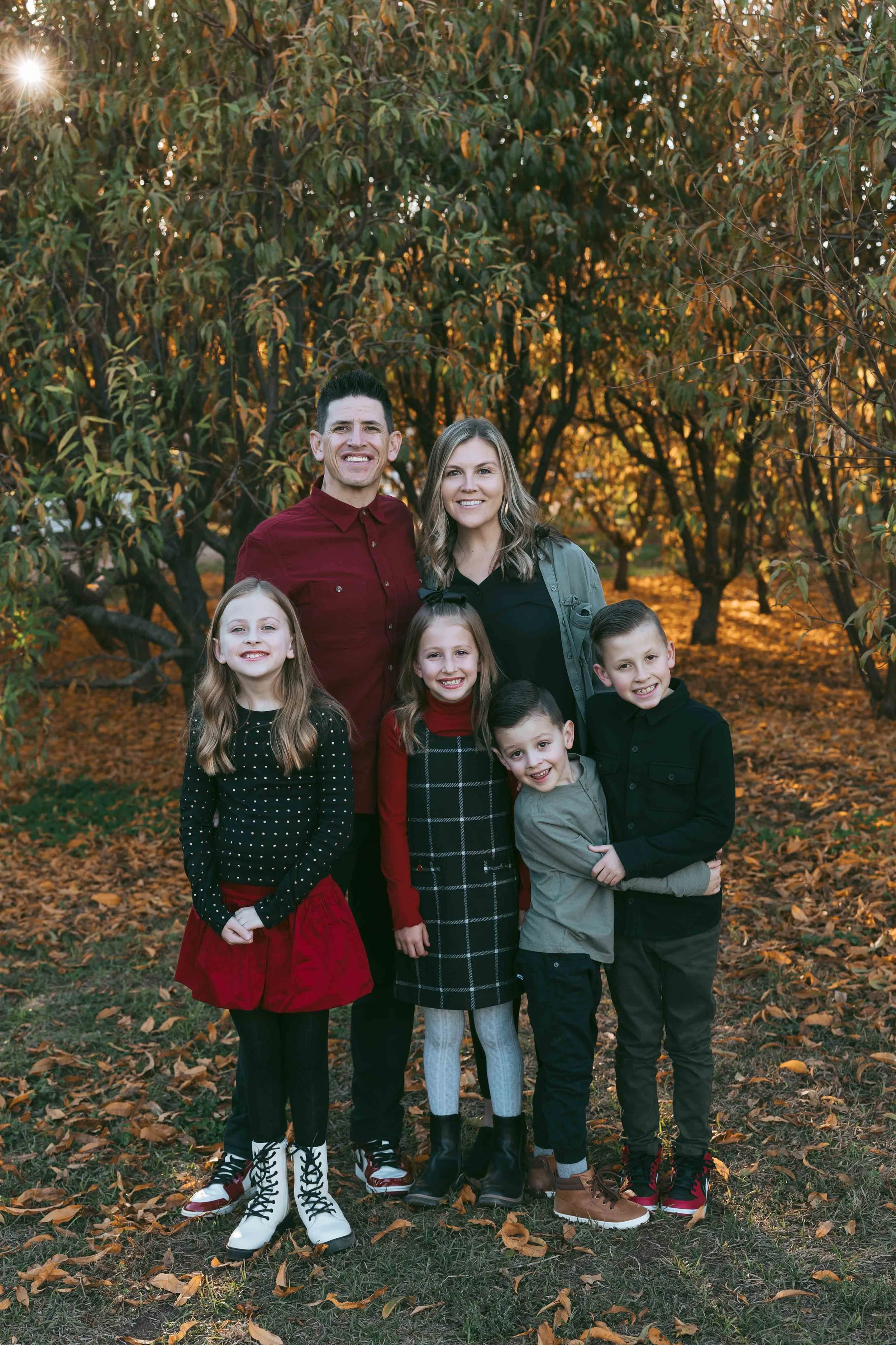 Gilbert family photographer captures Fisher family in autumn orchard