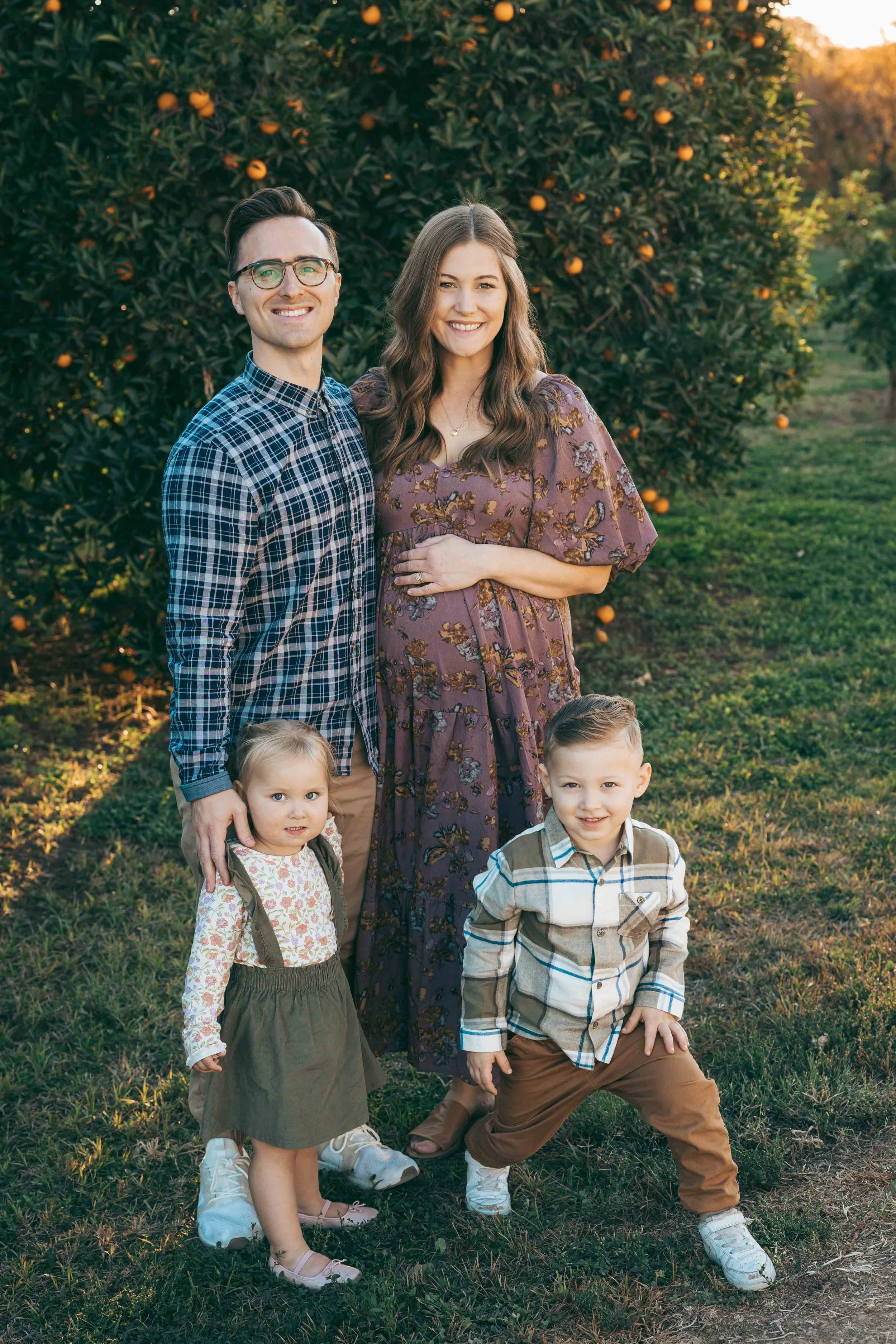 Gilbert family photographer documenting a growing family with pregnancy announcement photos outdoors