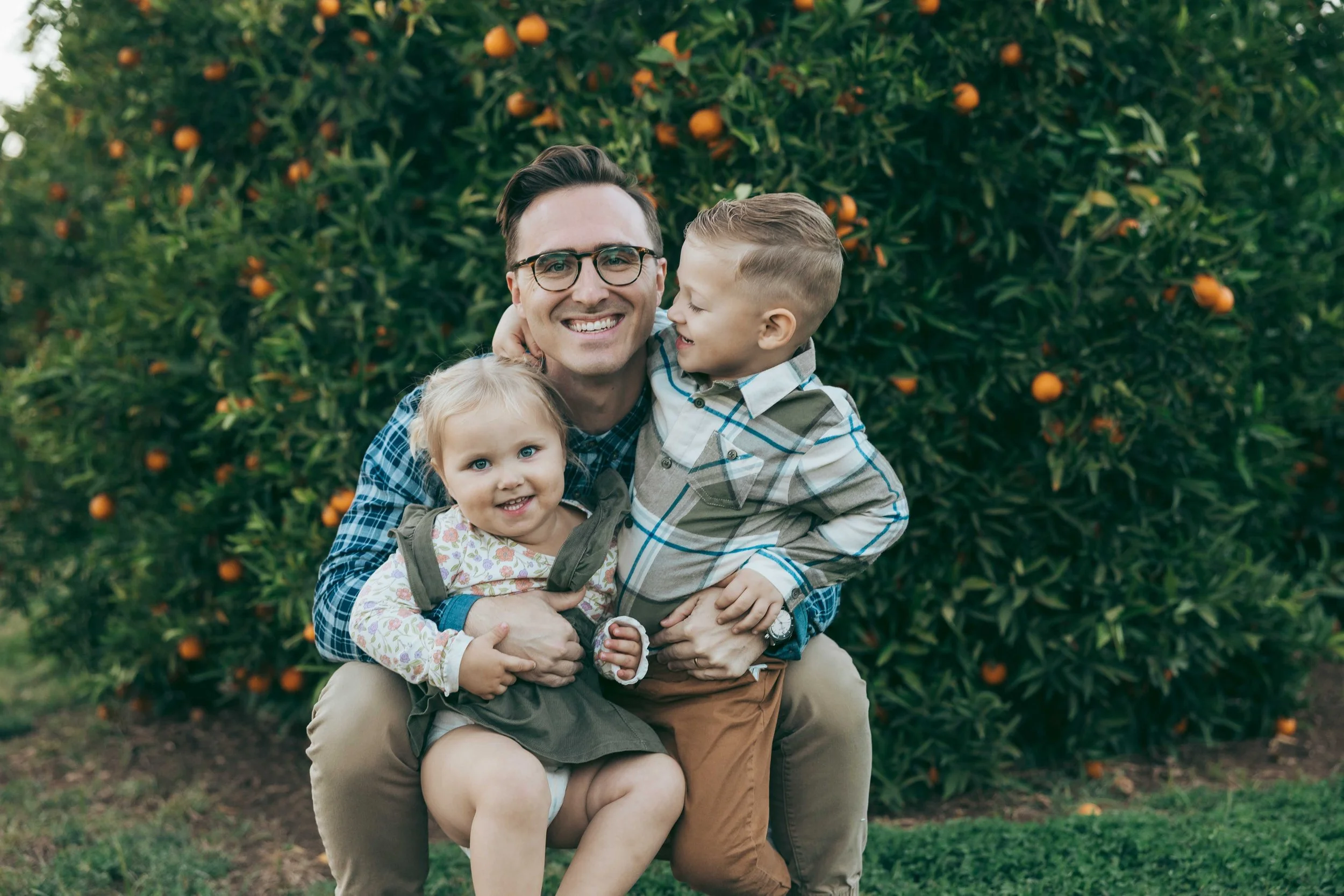 Fall family photography session at Agritopia Orchard in Gilbert with golden hour light