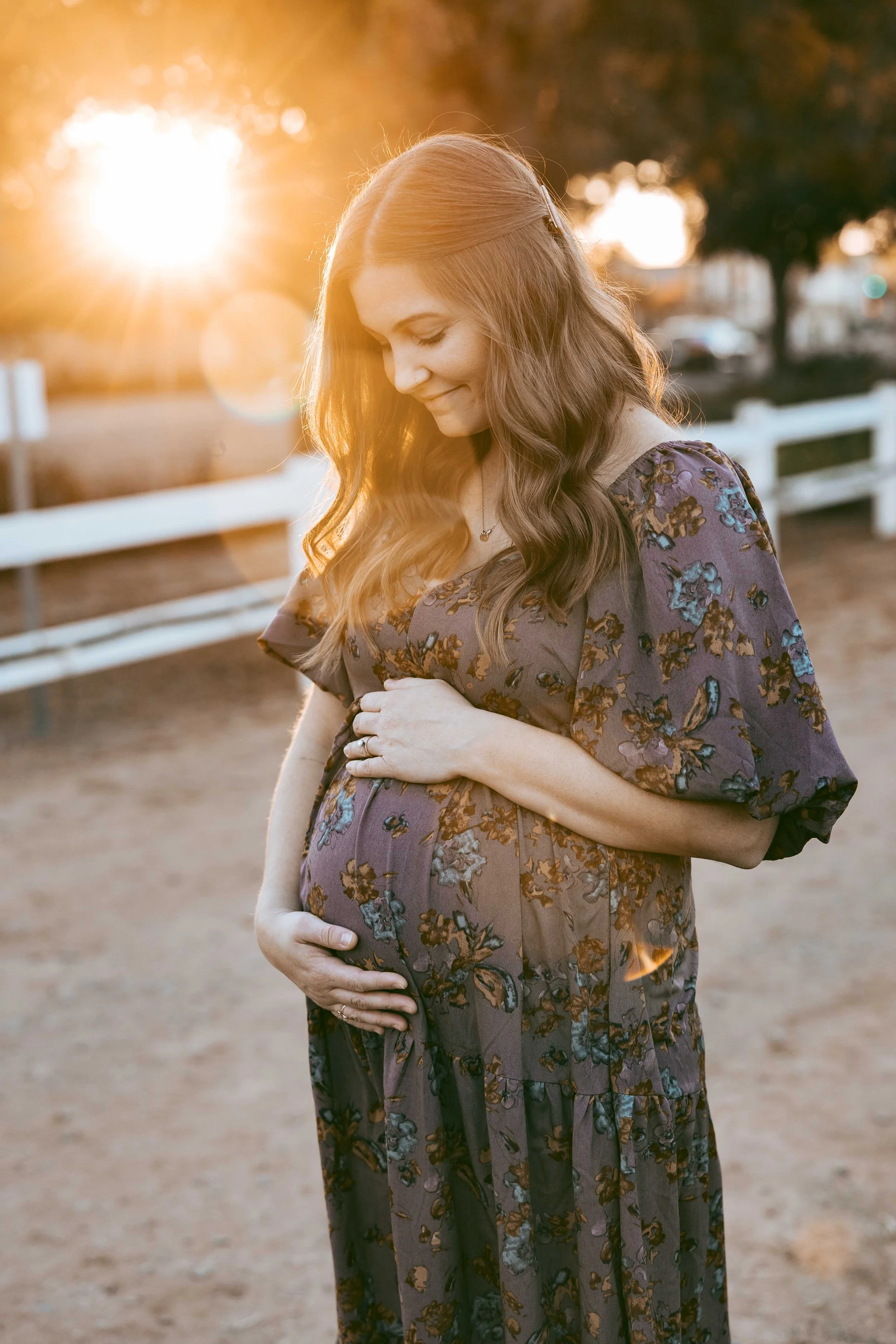 Pregnant mom with sunset behind her in Gilbert at Agritopia