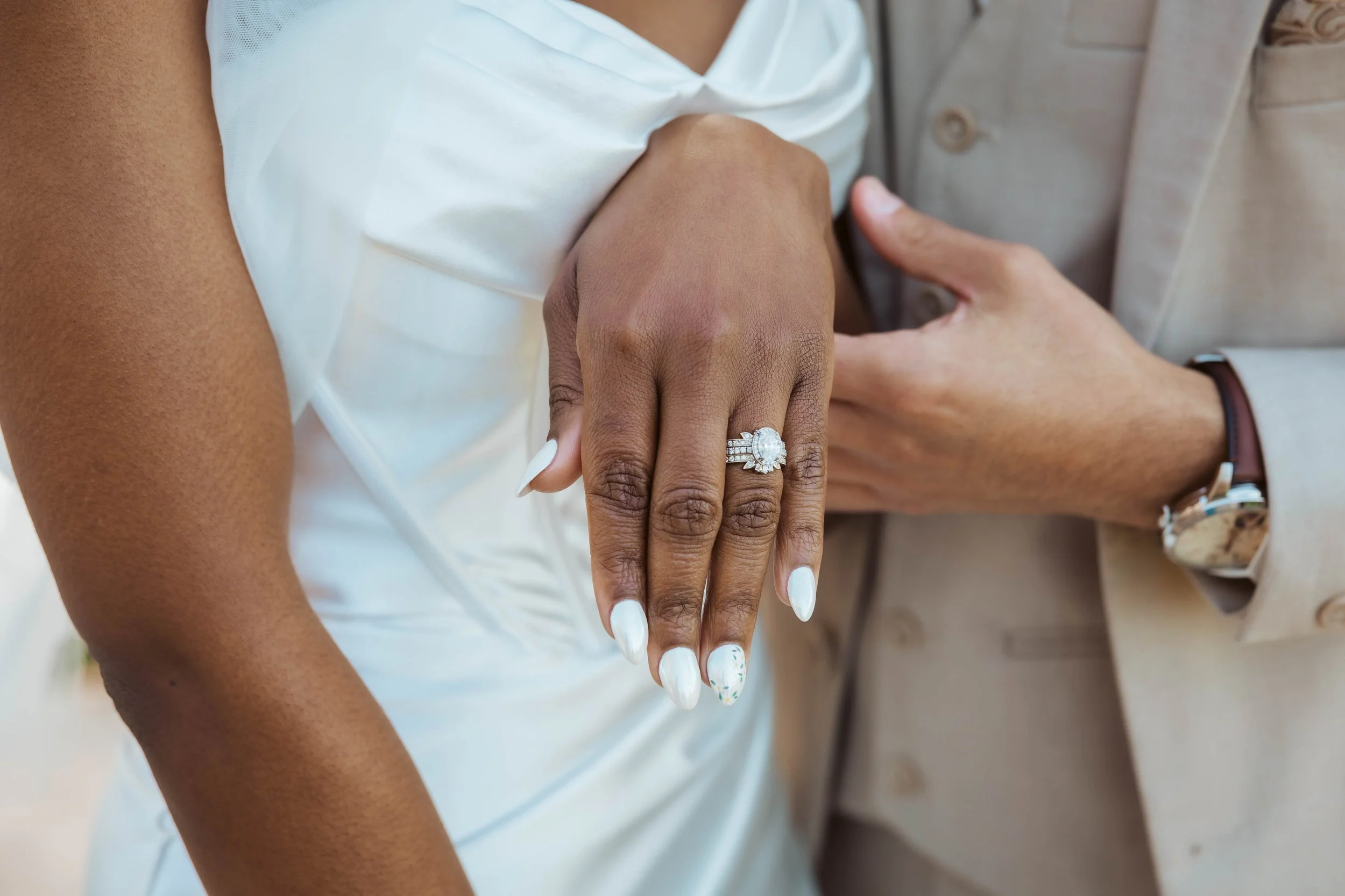 Close photo of wedding ring on Jades hand
