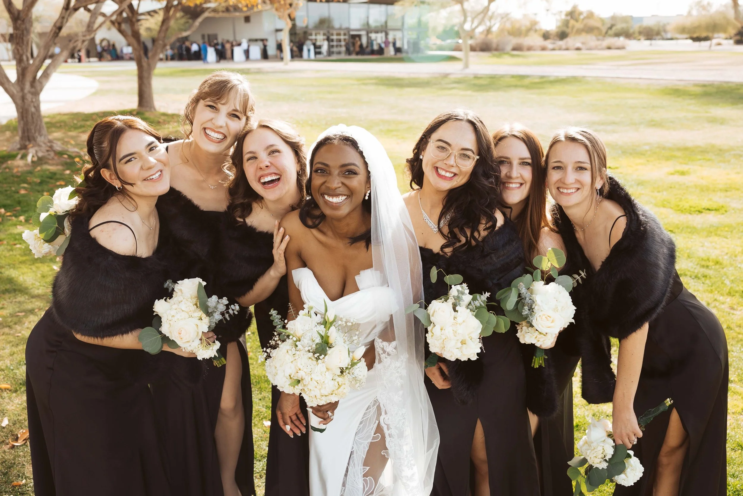 Bride with her bridesmaids during wedding portraits at Redemption Church