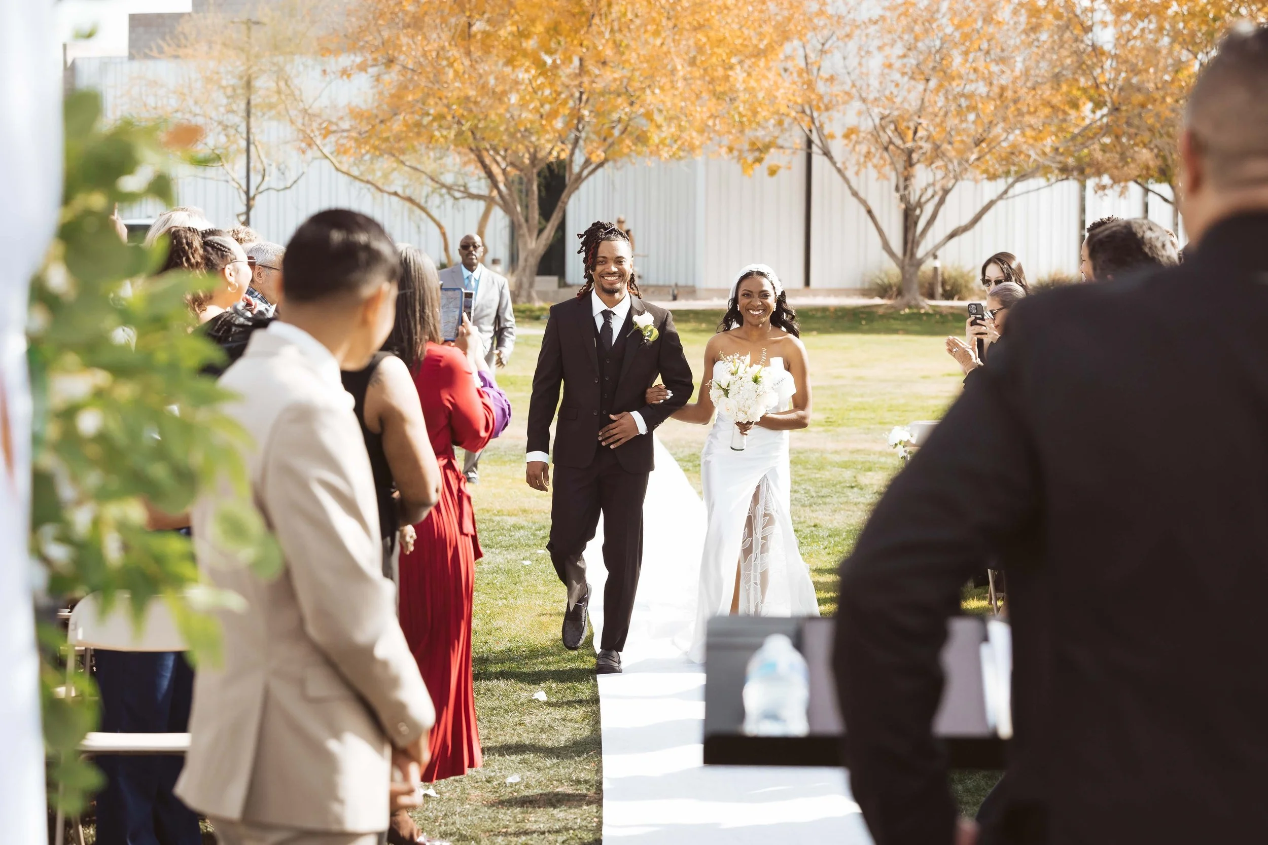 Wedding ceremony at Redemption Church in Gilbert surrounded by close friends and family