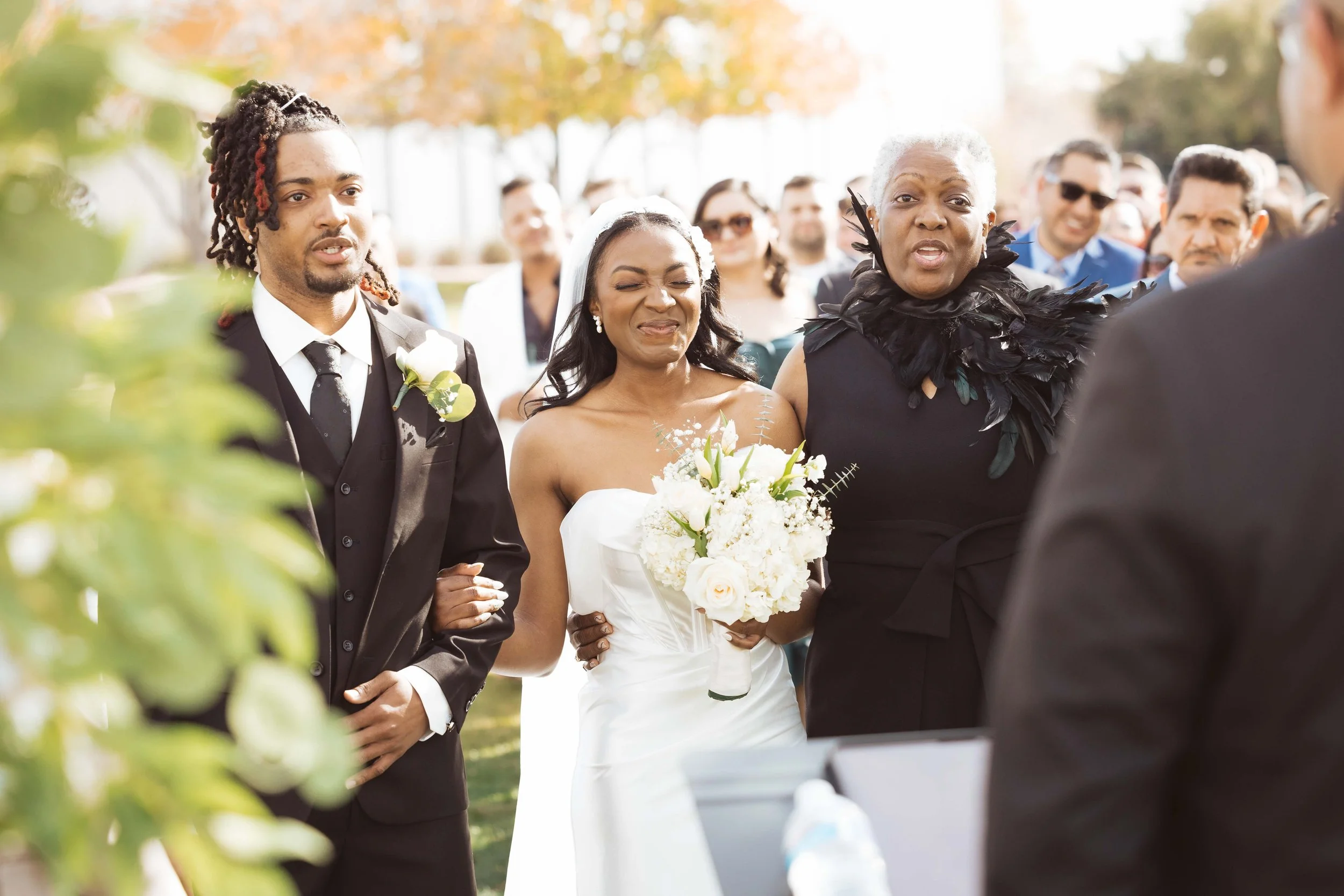 Jade walking down the aisle at her wedding ceremony in Gilbert