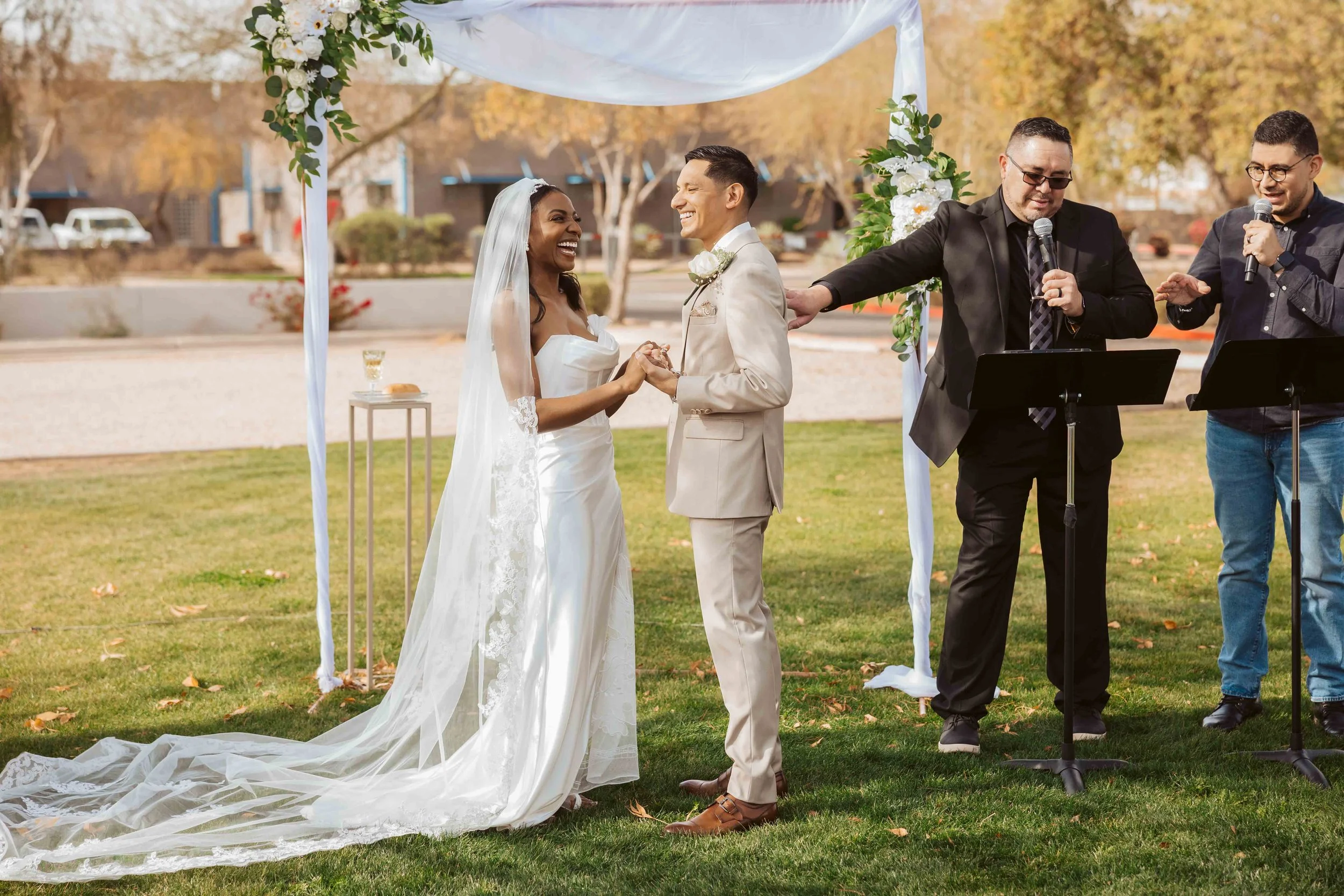Bride and groom holding hands during their ceremony at Redemption Church