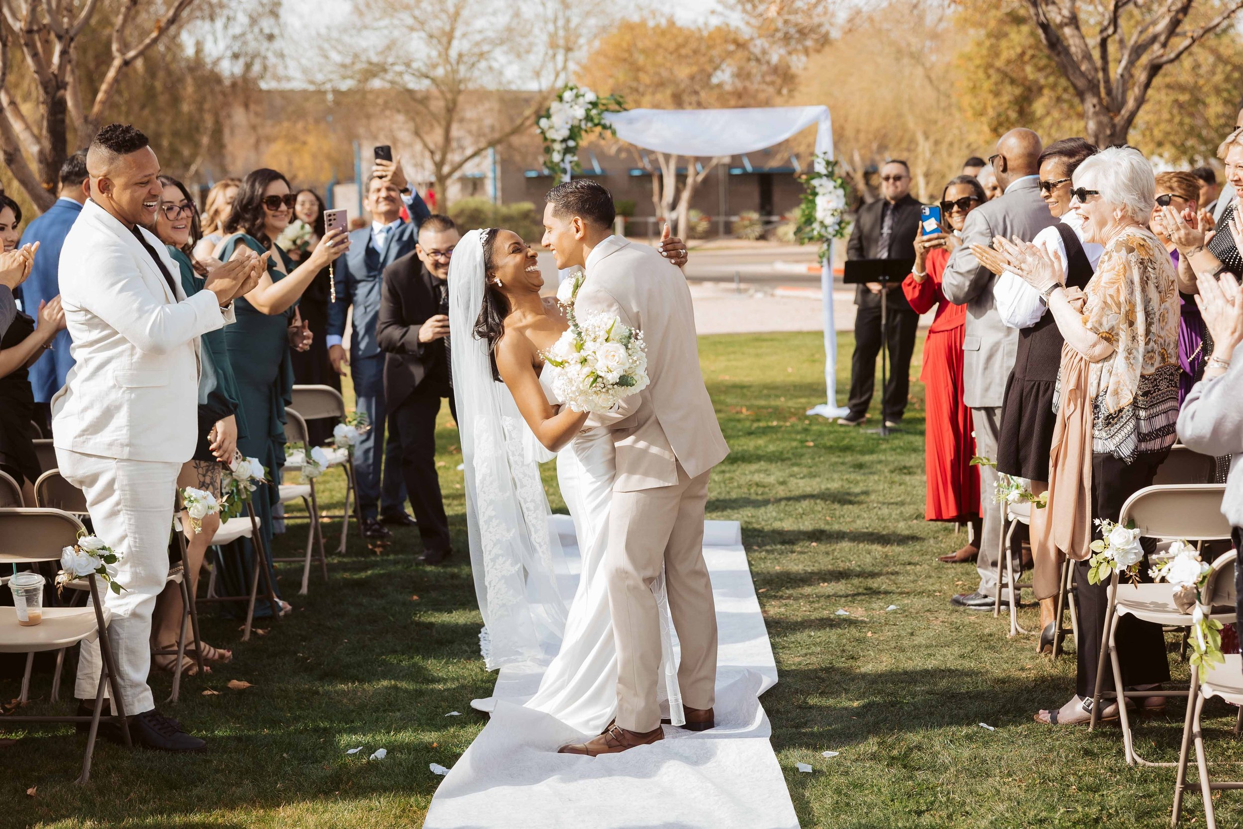 Jade and Able kissing during the wedding recessional
