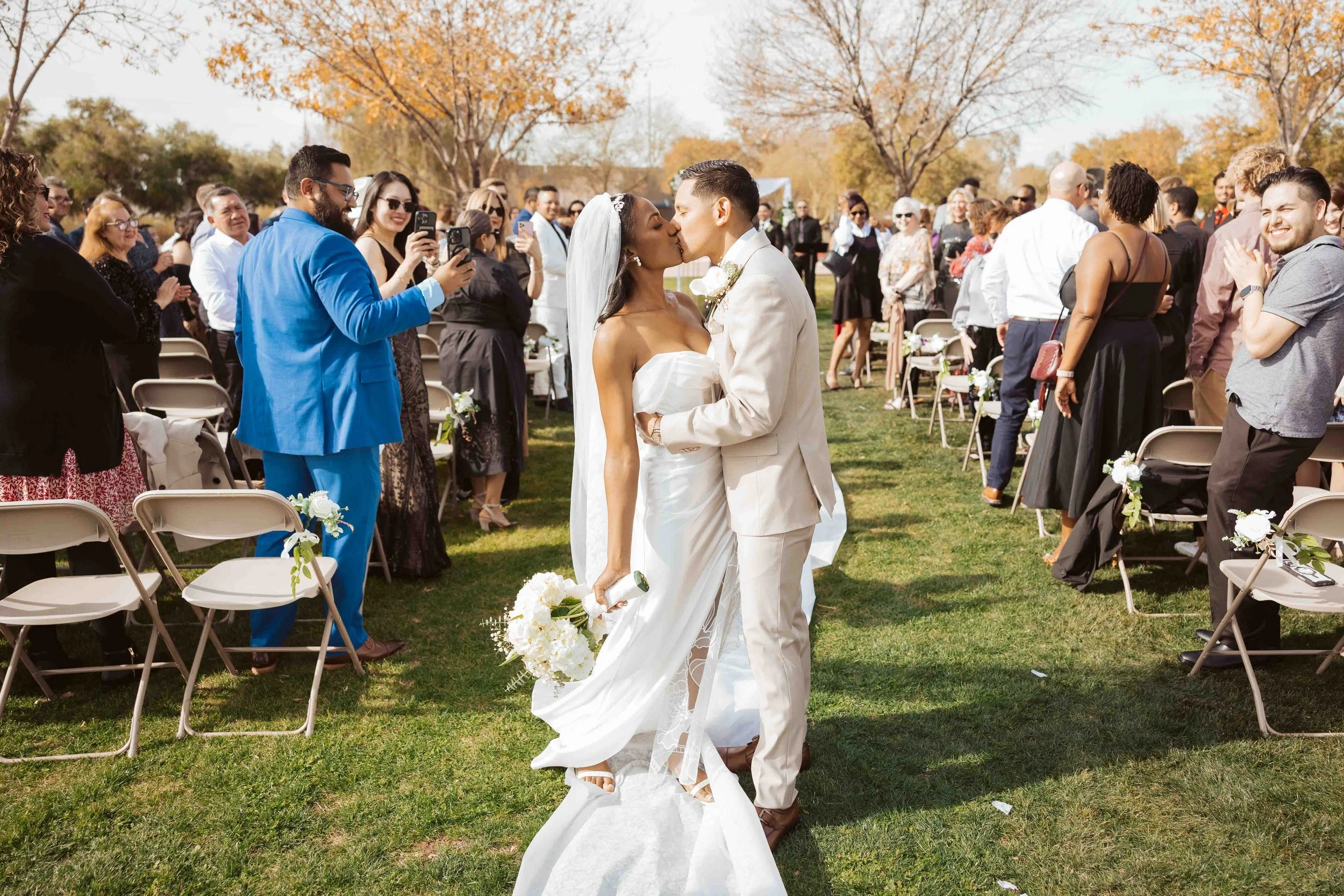 Jade and Able kissing during the wedding recessional
