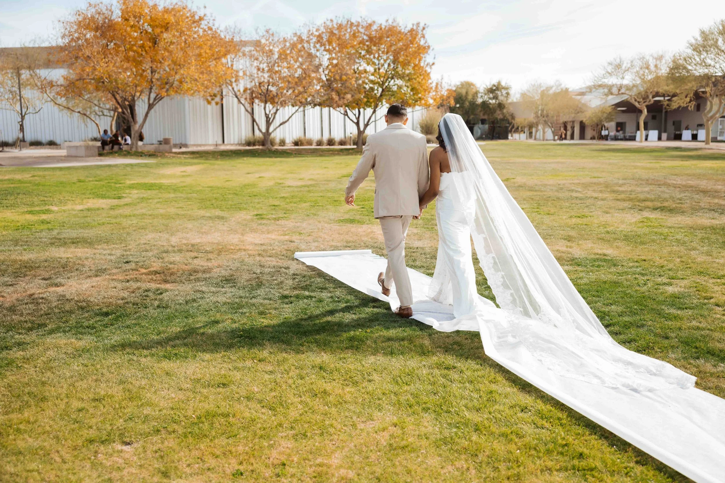 Jade and Able walking away from ceremony after the wedding