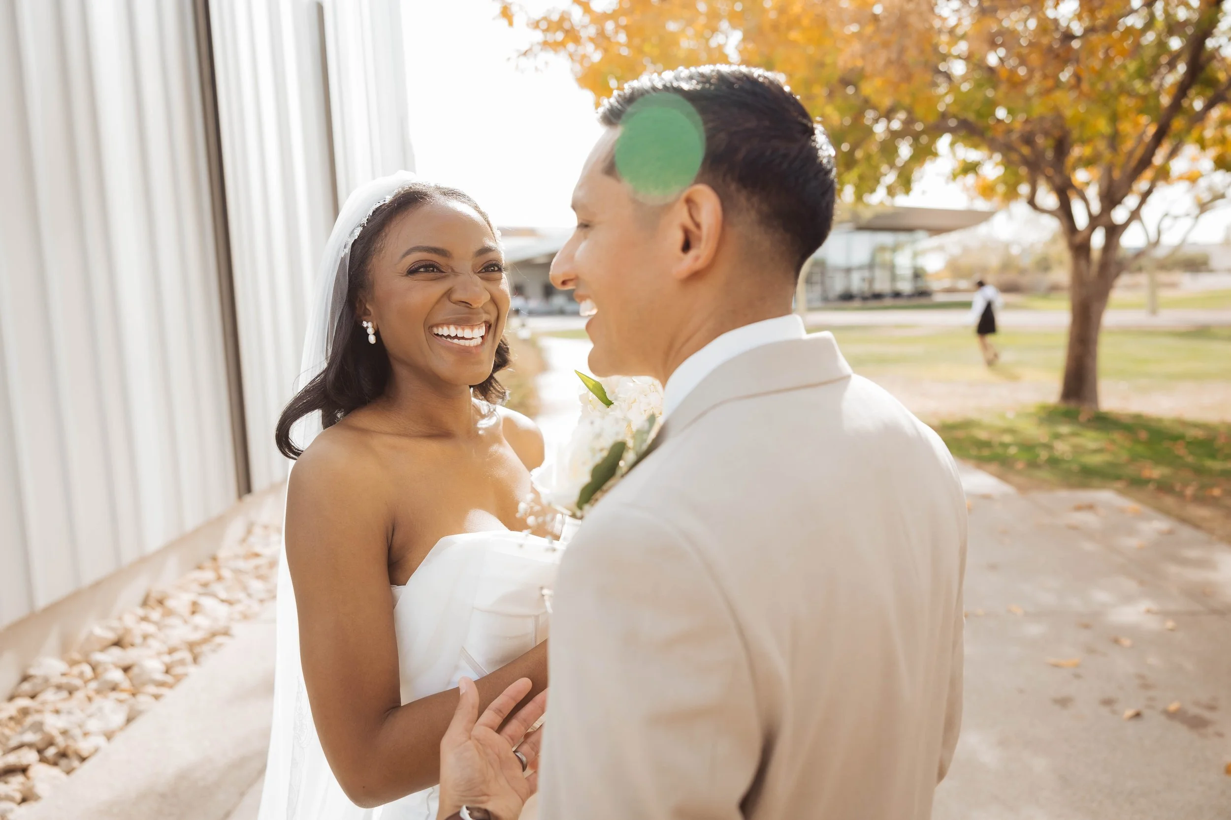 Bride smiling at her new groom after wedding in Gilbert