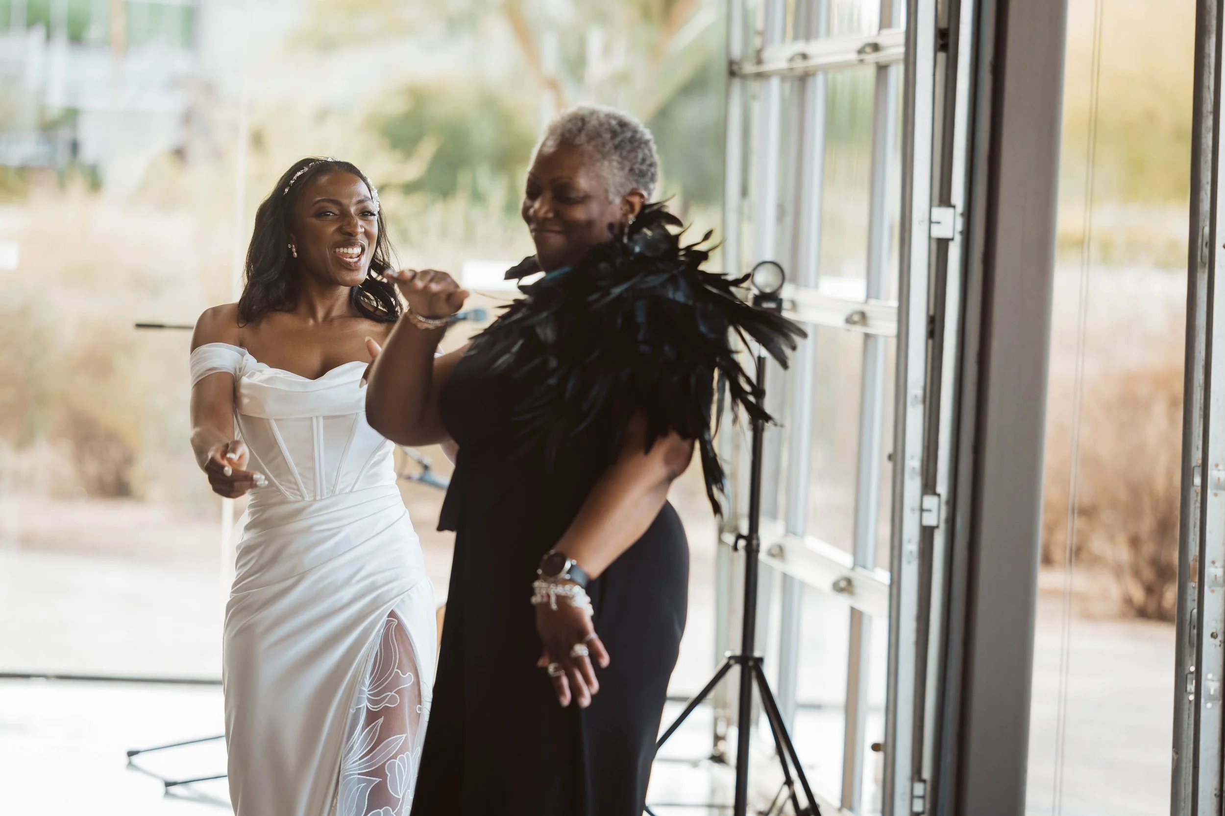 Bride dancing with her mom during wedding reception in Gilbert
