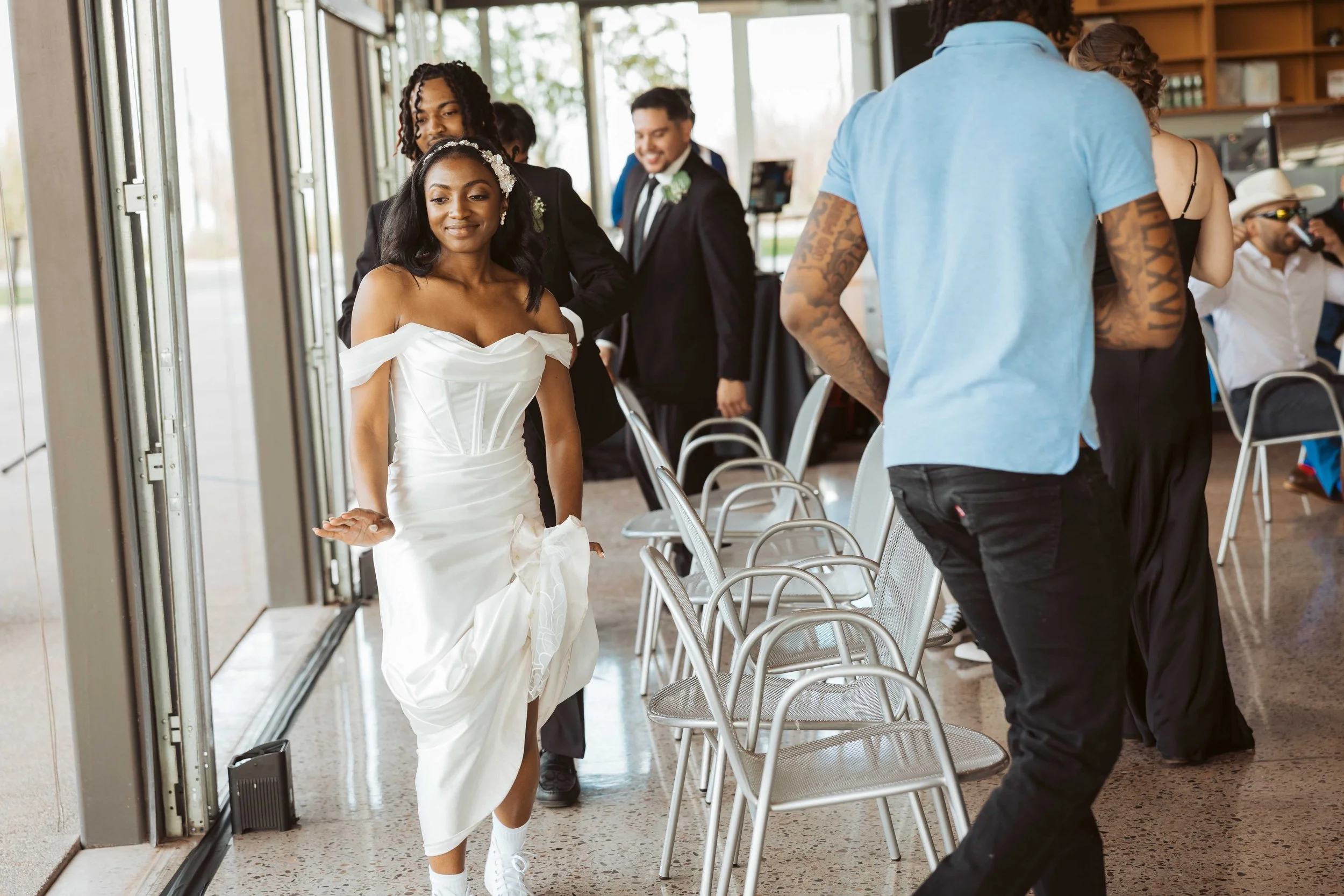Bride playing musical chairs during wedding reception in Gilbert