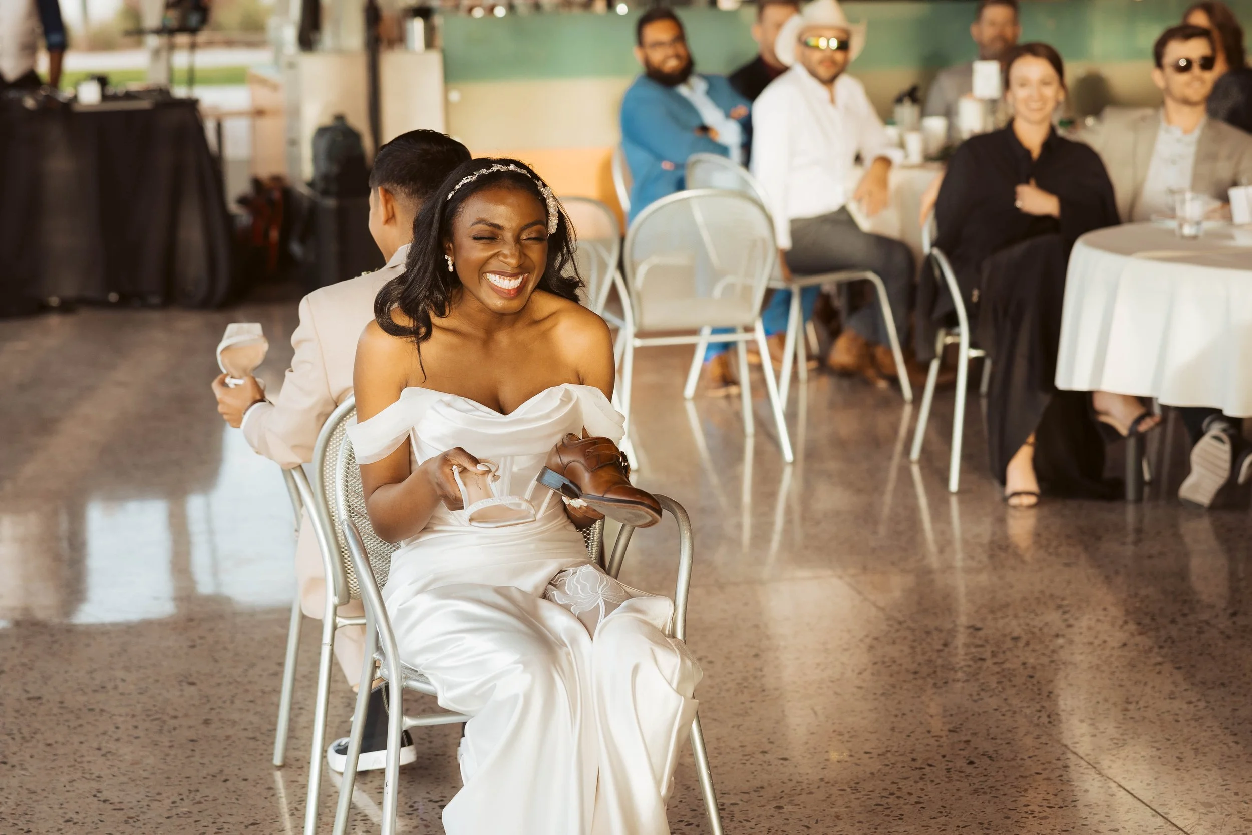 Bride playing shoe game at reception in Gilbert