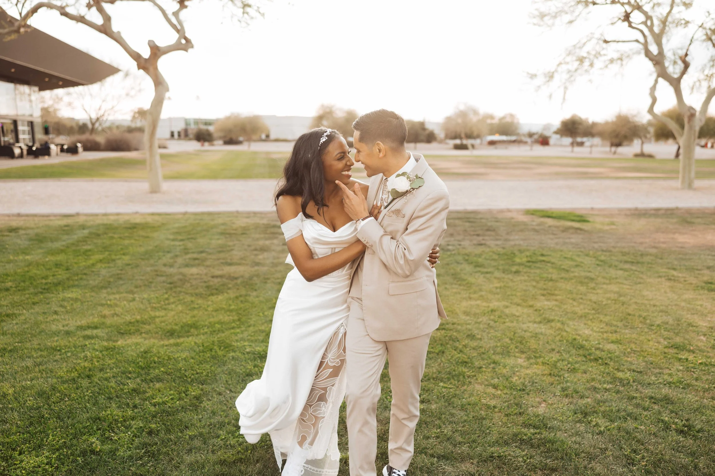 Couple laughing and walking during sunset photos at Redemption Gilbert