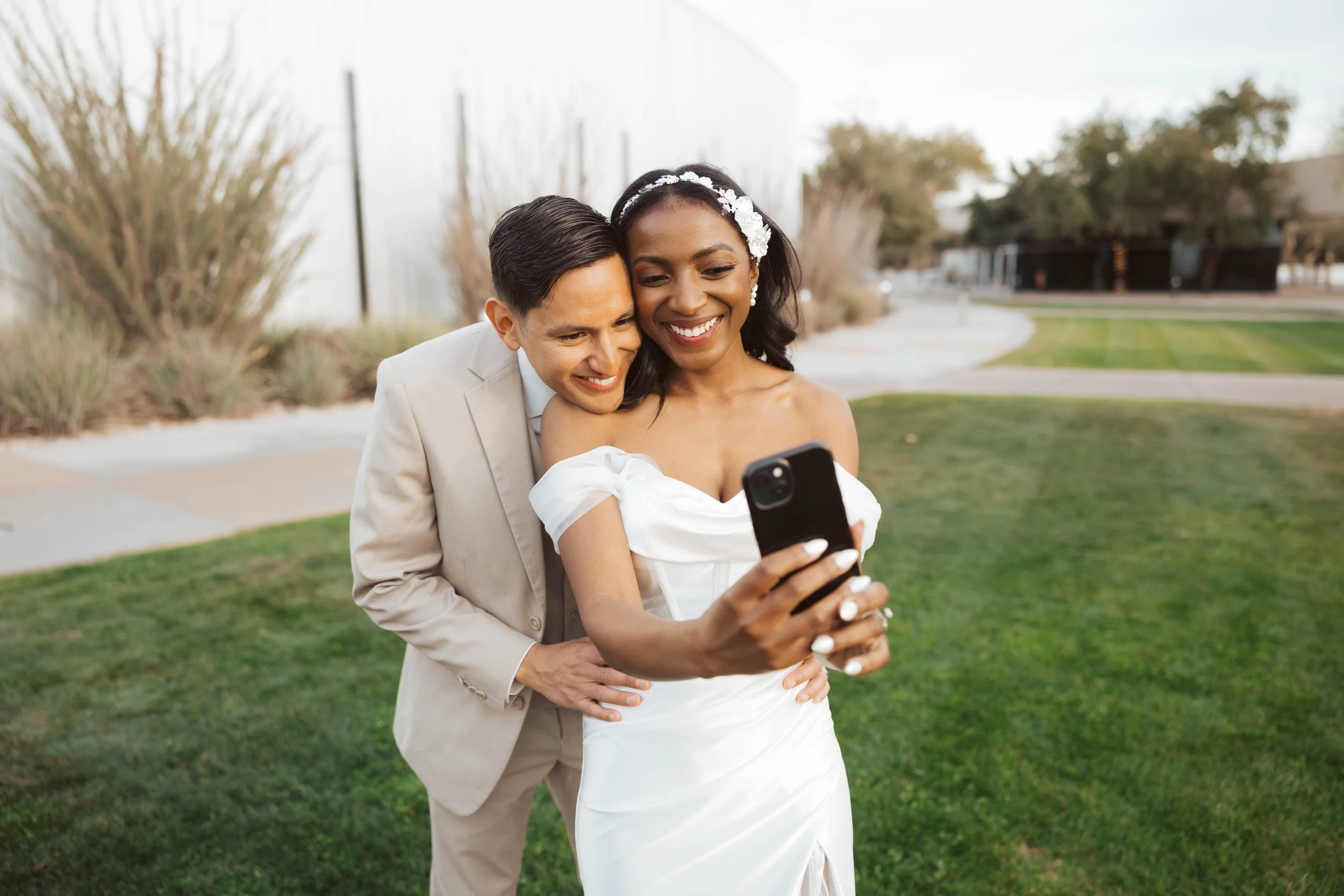 Couple taking a selfie during sunset photos at Redemption Gilbert