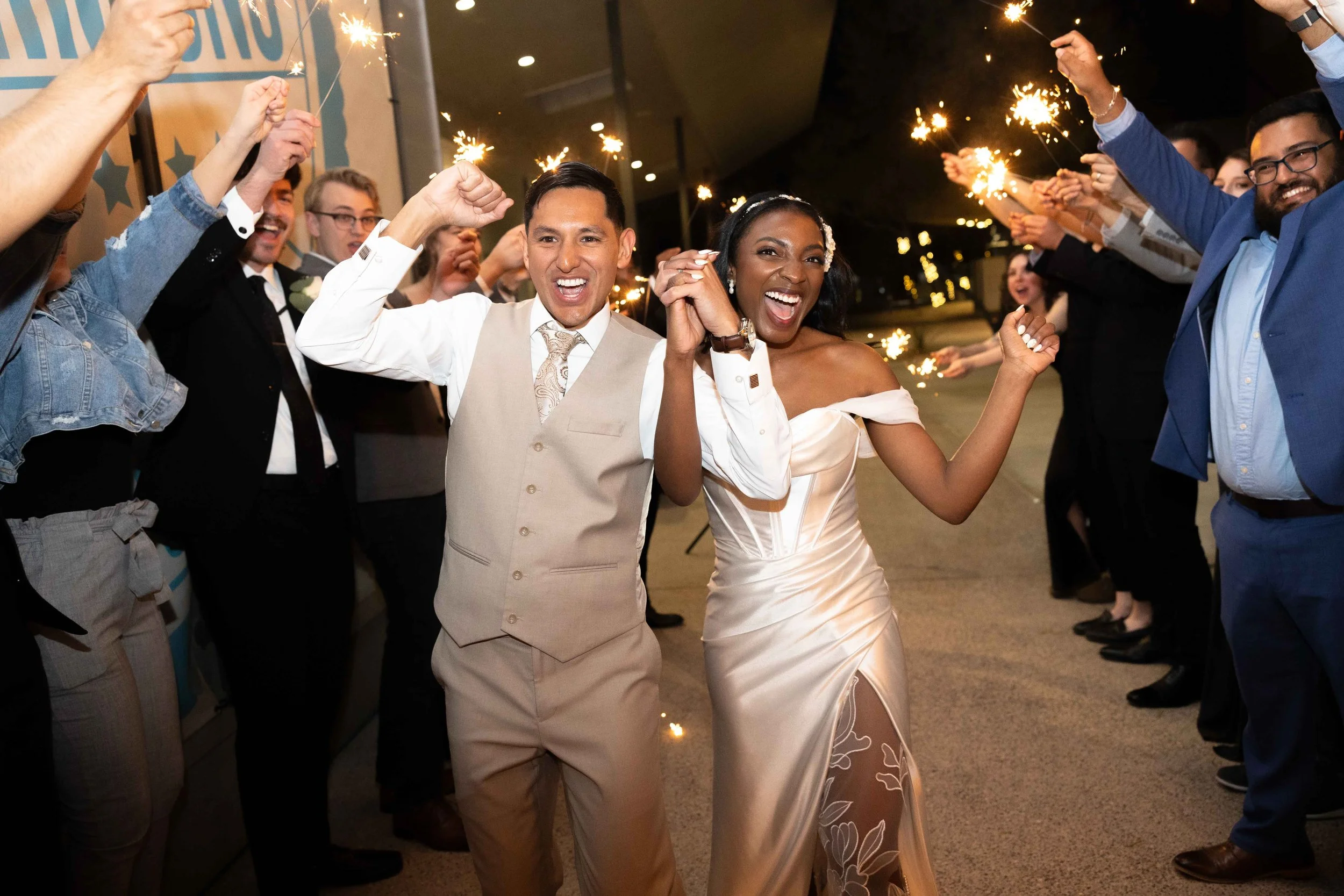 Bride and groom during sparkler exit at reception in Gilbert
