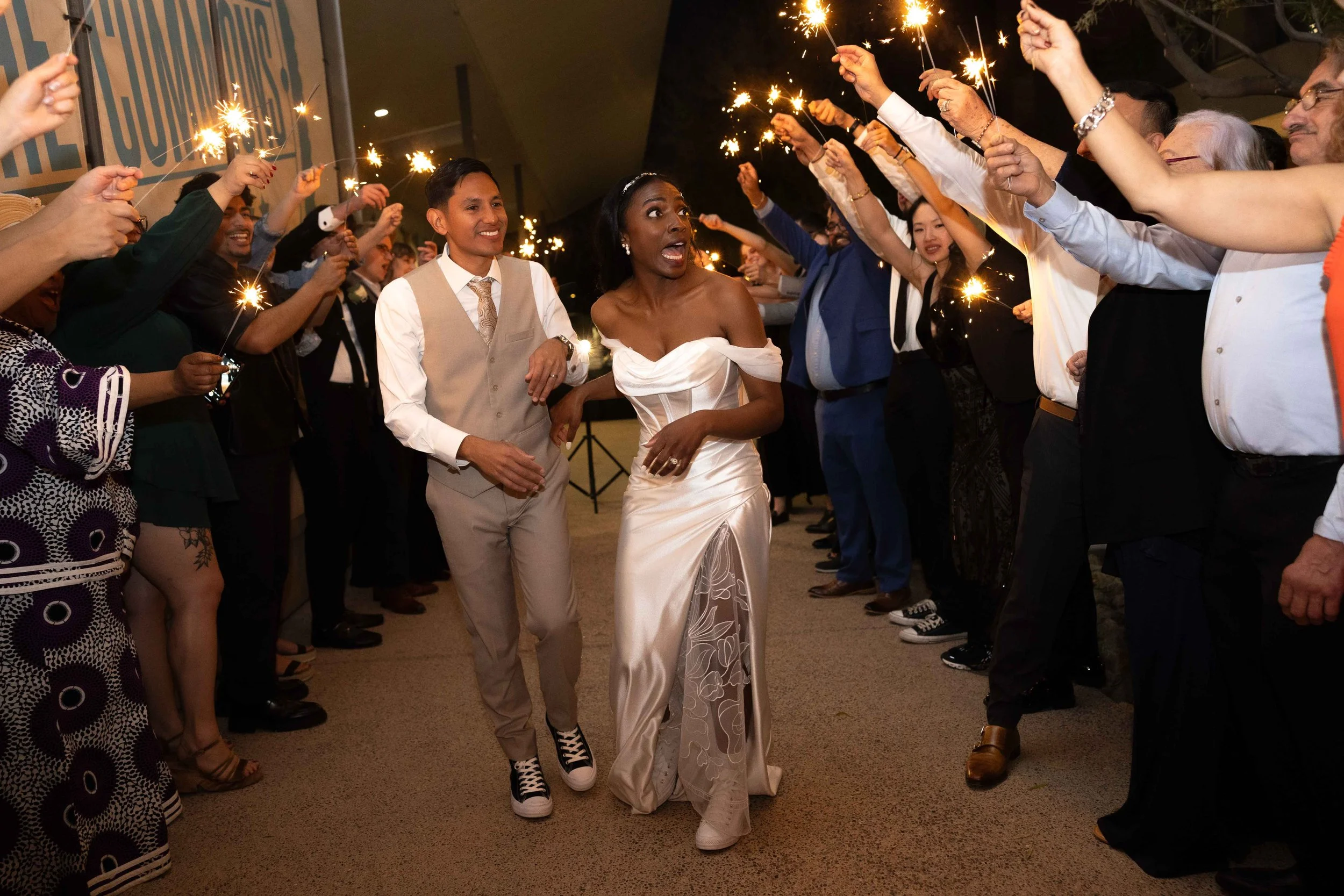 Bride and groom during sparkler exit at reception at Redemption Gilbert Church