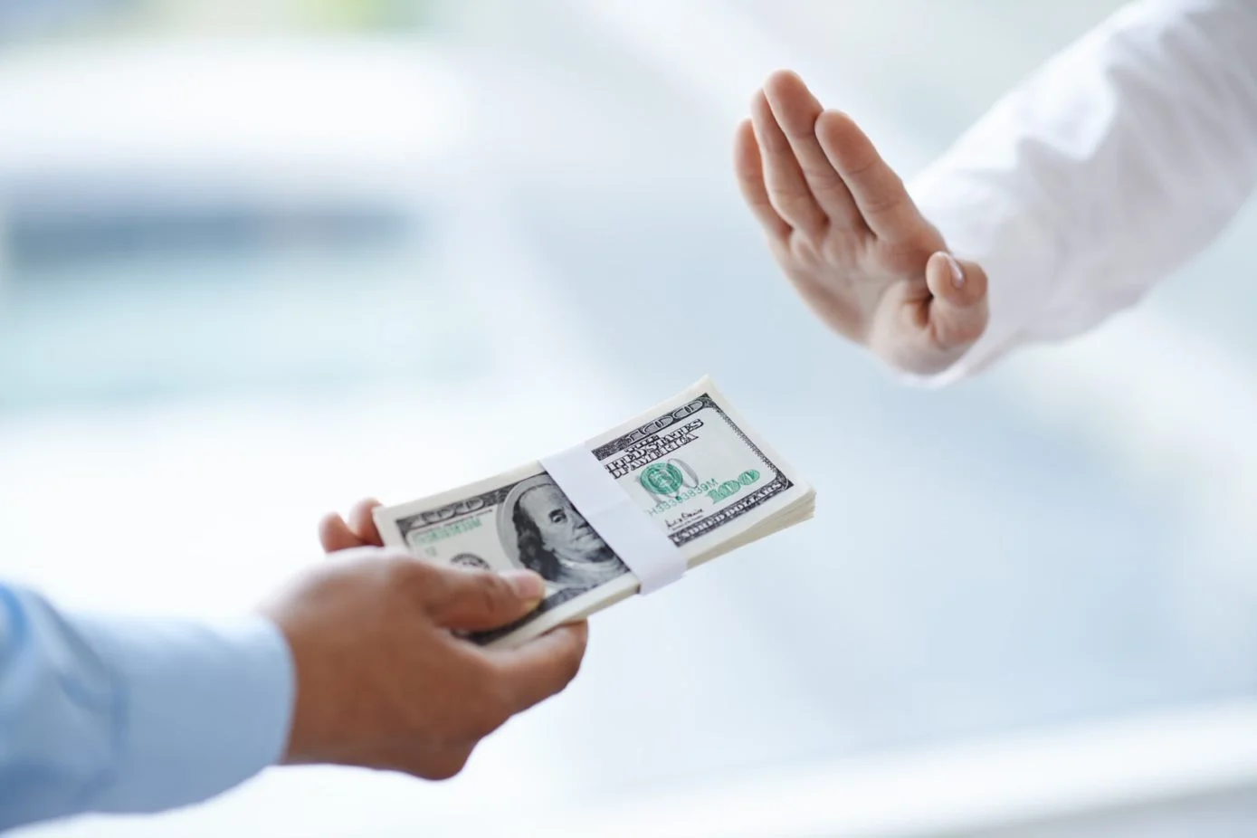 hand refusing money.jpg