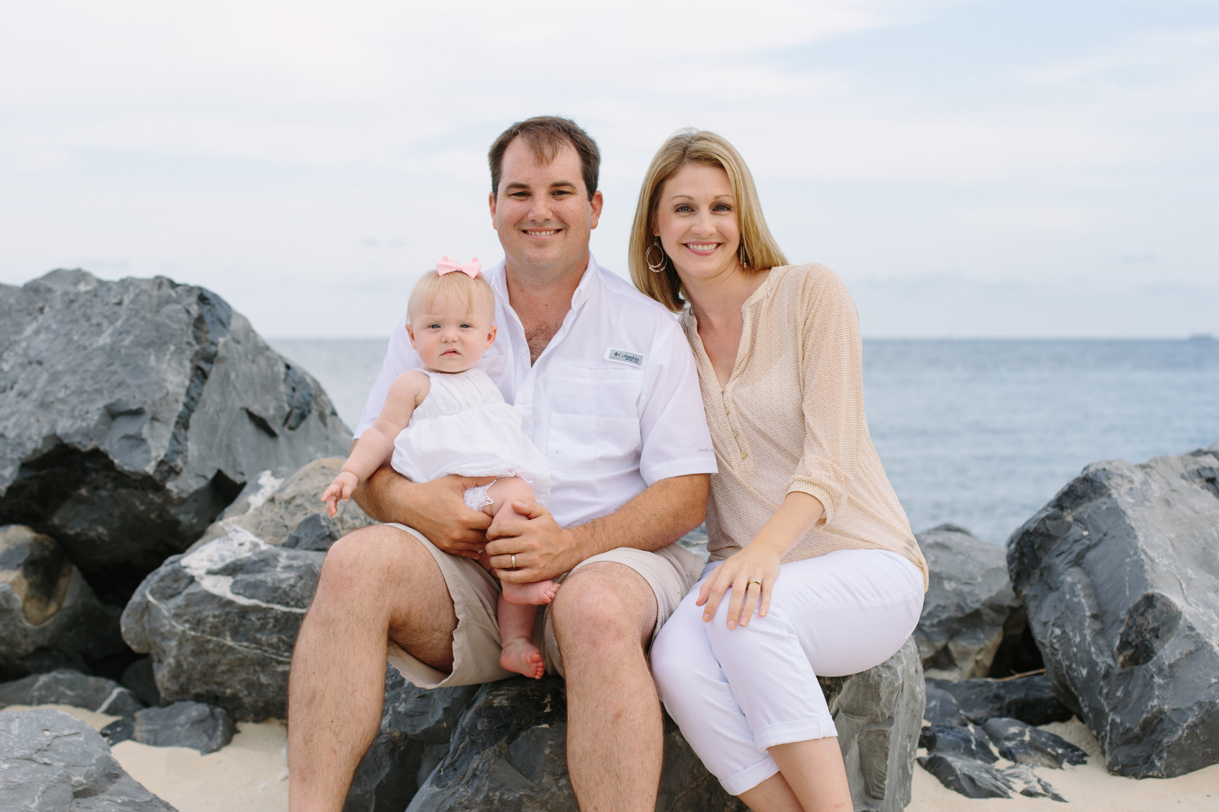 Here, the lovely Vaughan Family have chosen white & khaki for their beach photos. The gray in the rocks & the water is a beautiful contrast to their skin tones & clothing choice,