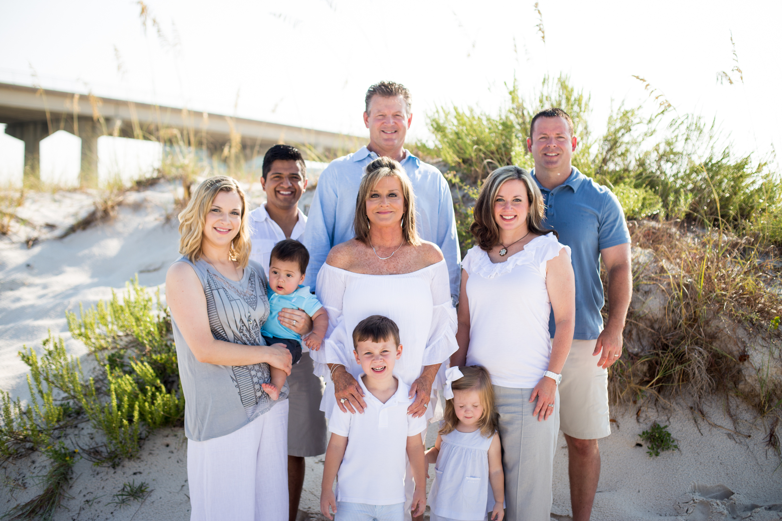 The Wallace family adds in pops of light & darker blues & grays to contrast the white & khaki. Beautiful family!!