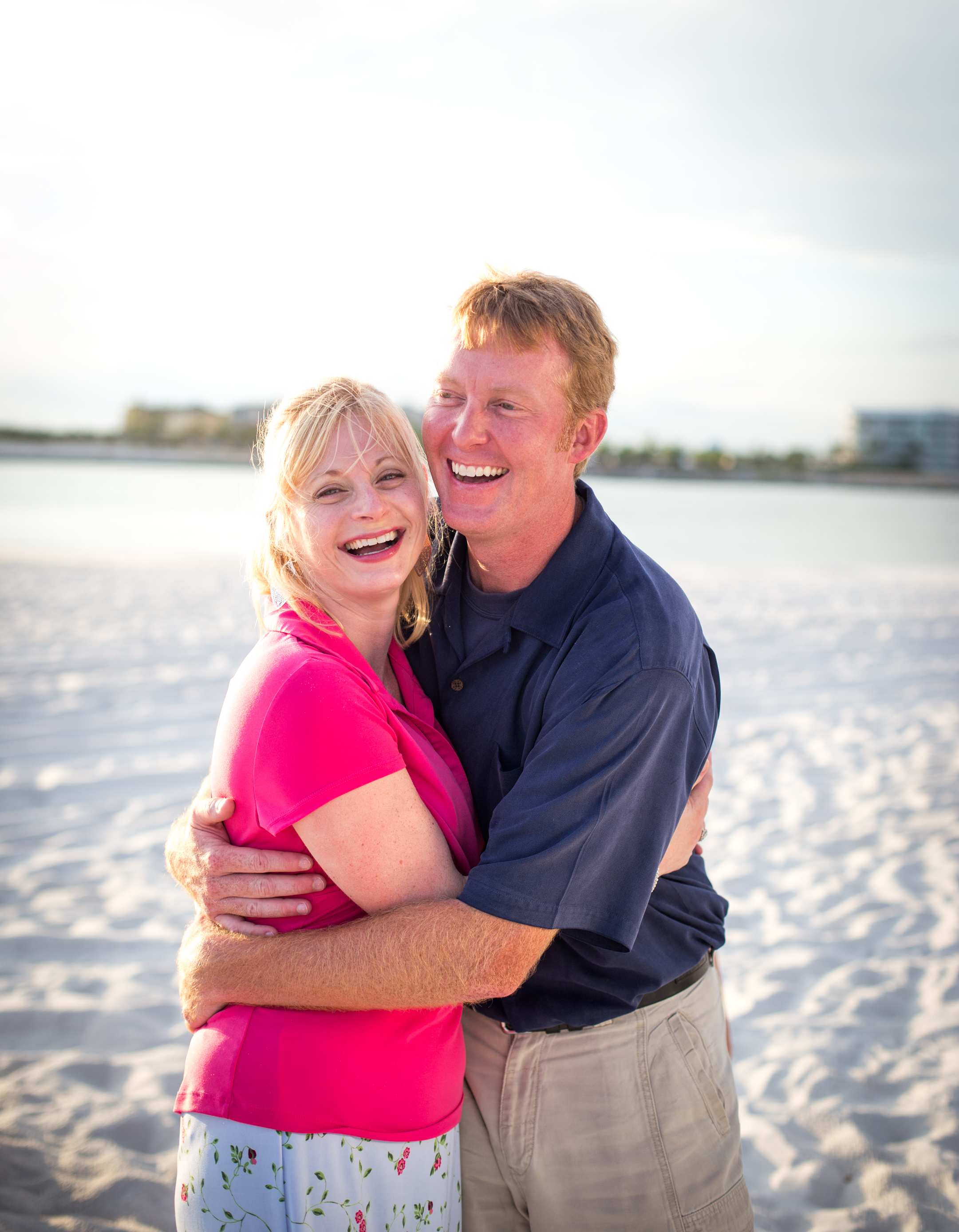 The Elrods went with bright pops of pink & contrasted with navy for their evening beach session. Love the contrast!
