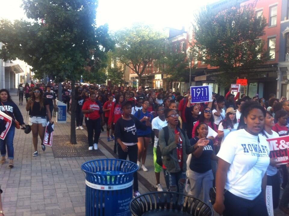  Passing the Carnegie Library, on the way to march. Numbers have swelled. Over a thousand Howard U students. 







